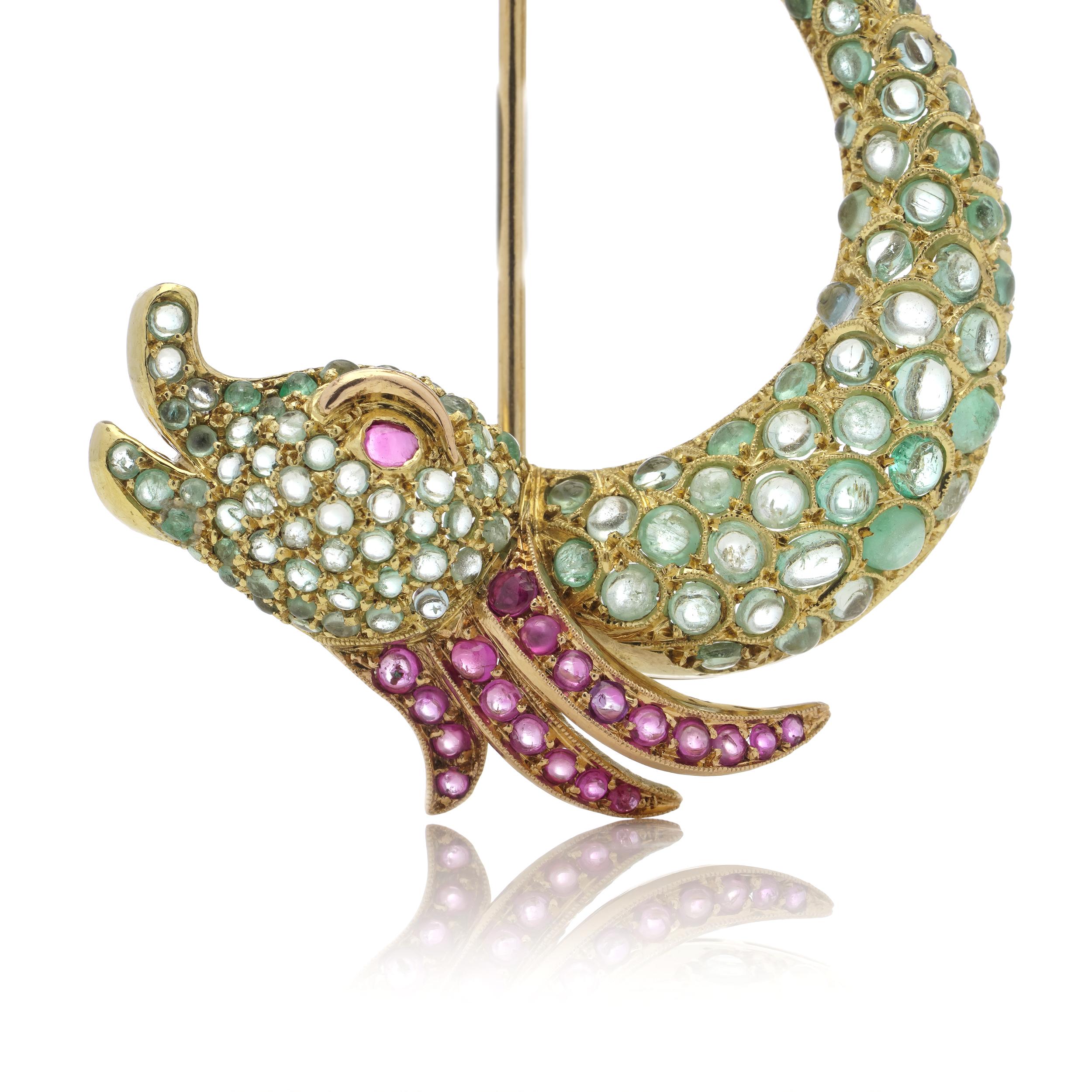 Vintage 800. gold (19.2 kt. ) yellow gold whimsical fish brooch, set with round cabochon - cut rubies and emeralds.
Made in Portugal, Circa. 1930s-1980s
Maker's mark is unidentified.

The dimensions -
5.6 x 4.1 x 1.2 cm
Weight: 15.00 grams

Emeralds