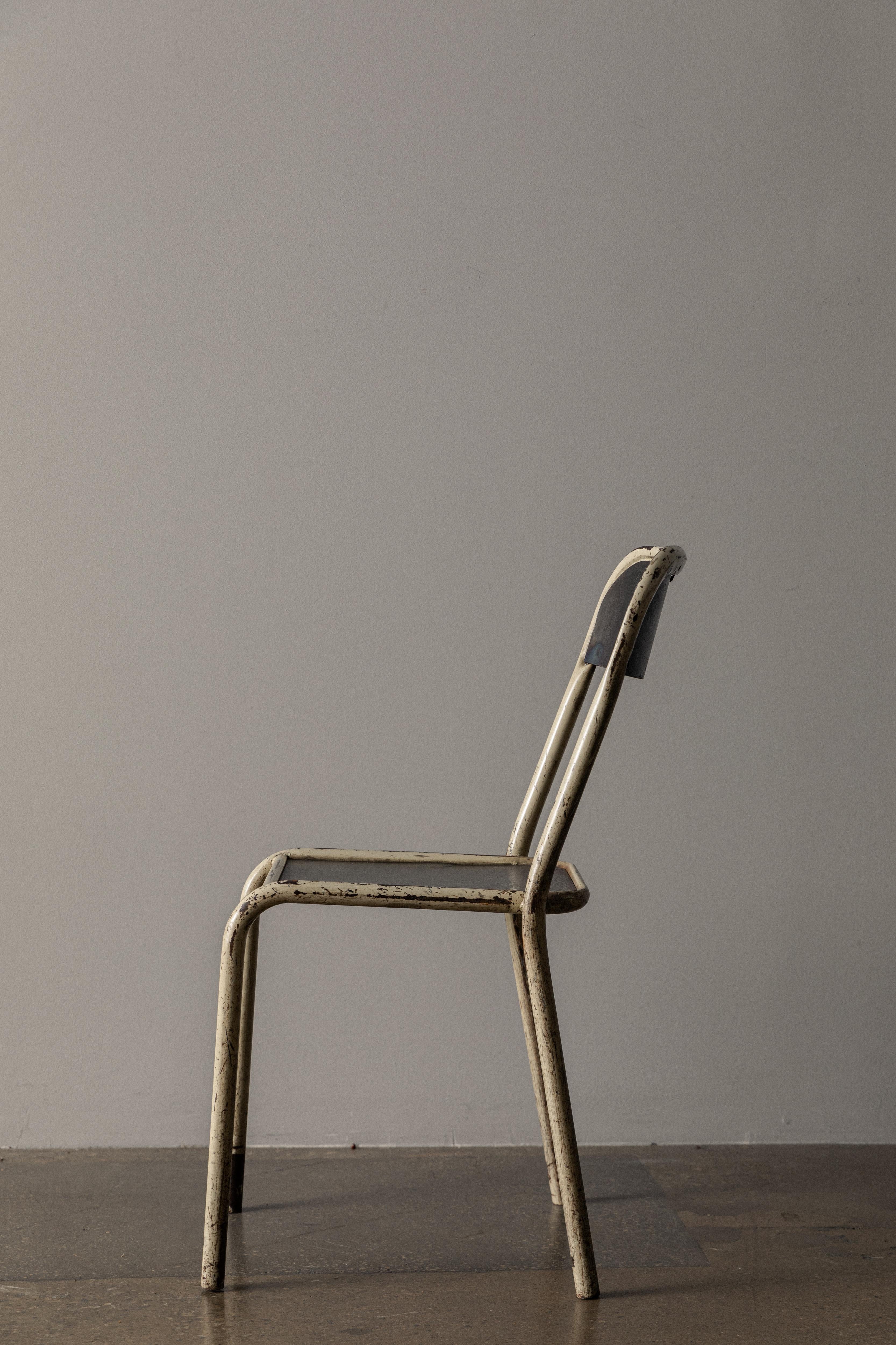 This side chair is crafted from durable iron and features a classic white finish that adds a touch of brightness and refinement to any space. 