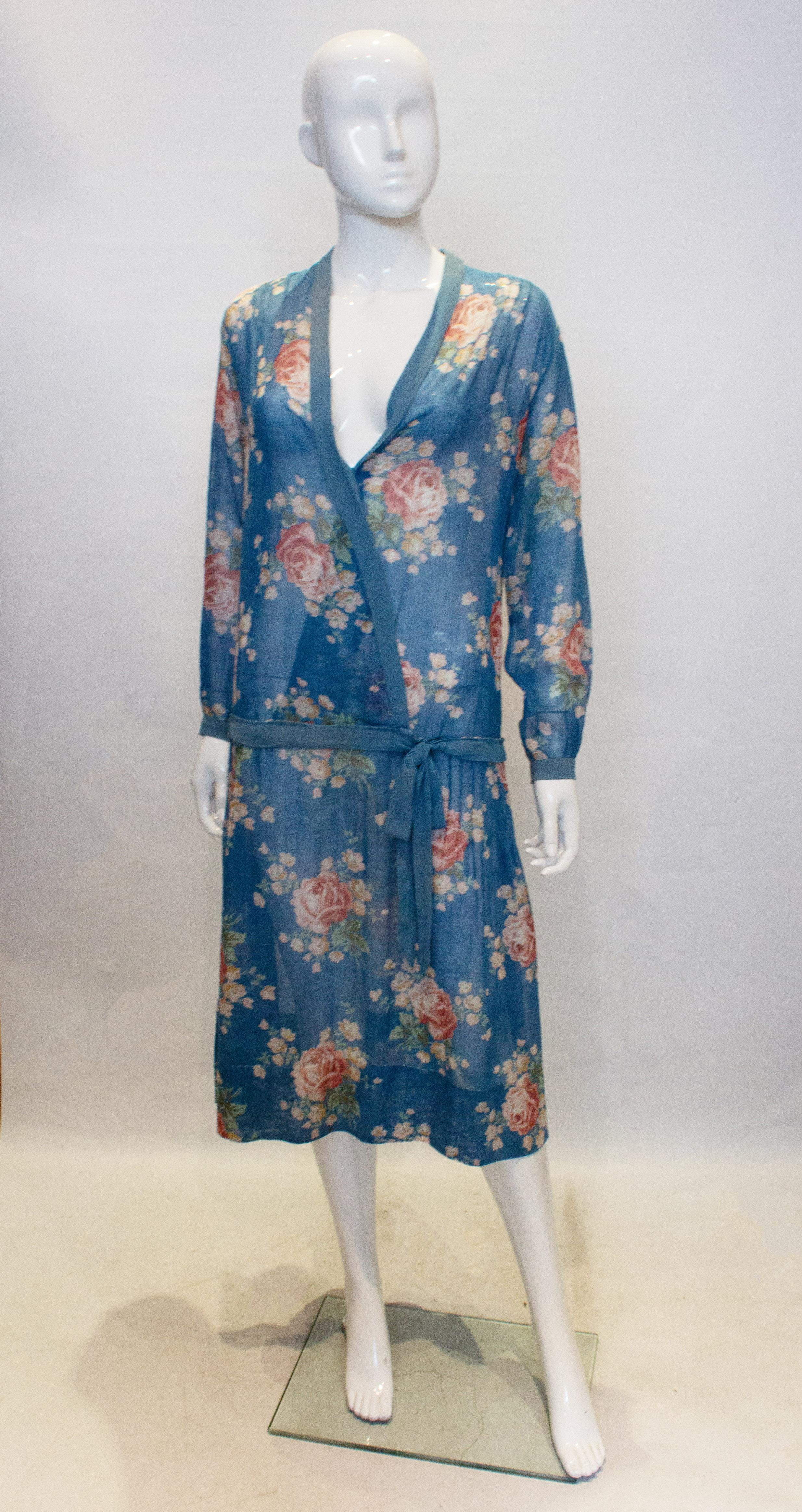 A lovely vintage dress for Summer. In a turquoise blue with a floral print, the dress has a drop waist, pintucks on the shoulders and blue banding along the neckline, cuffs and drop waistline.
Measurements: bust up top 38'', length 42'' plus a 4 ''