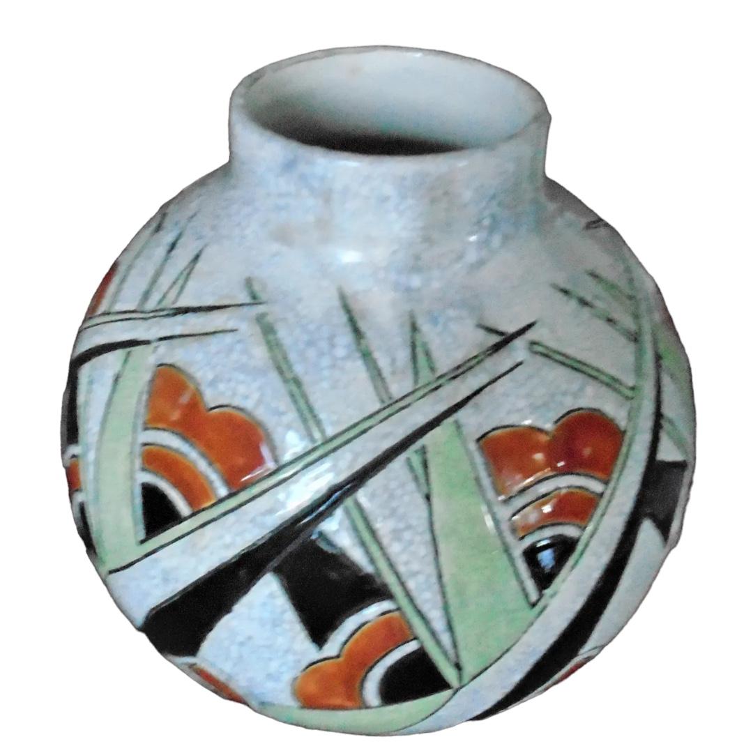 Excellent condition! ceramic vase with geometric pattern in orange, green, and black; a classic example of Art Deco from Boche Freres; a perfect addition to any room decor

9.75”dia. x 9.5”h