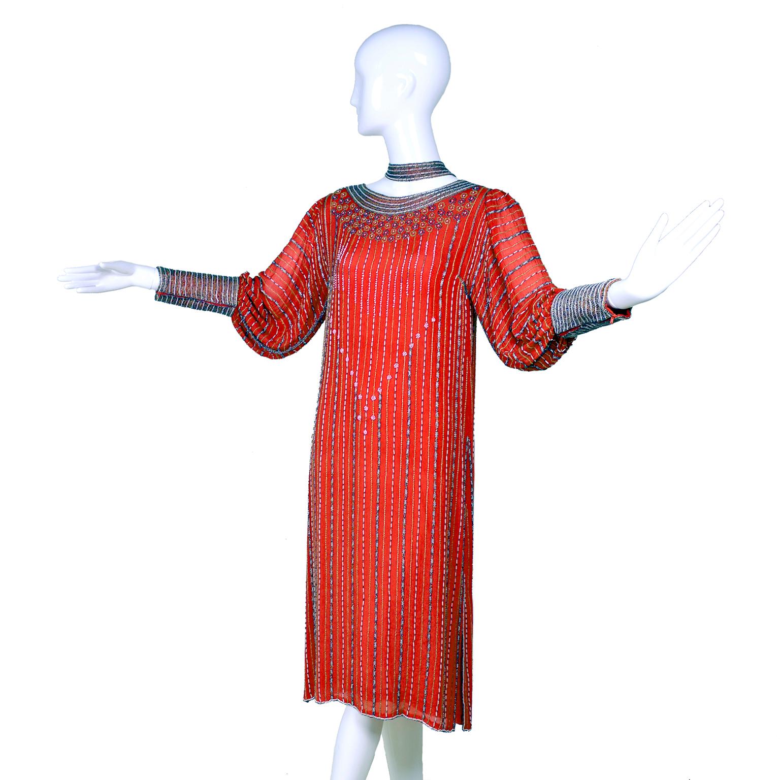 We adore this beautiful vintage dress from the late 1970's or early 1980's, inspired by the 1920s.  When worn without the belt, it looks like a beaded 20's flapper dress and when belted it takes on an entirely different look!  The dress has long