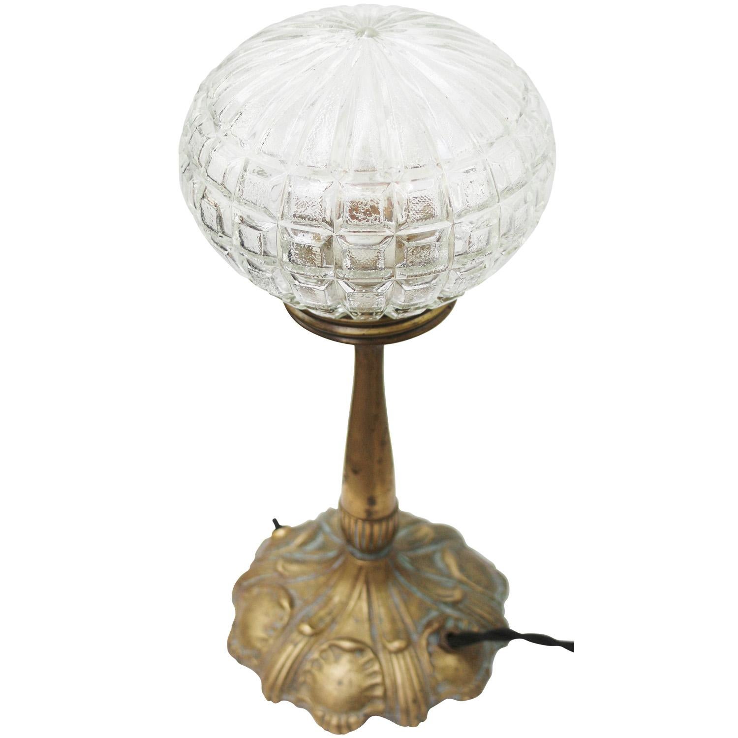 Brass tabel desk lamp with glass globe. ca. 1920

2,5 meter black cotton flex with plug and switch in base

Available with US/UK plug

Priced per individual item. All lamps have been made suitable by international standards for incandescent light