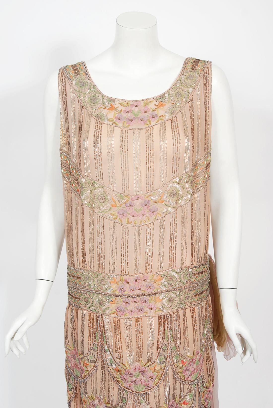 There are lots of lovely antique garments still in existence, but every once in a while I come across one that stops me dead in my tracks. This is an extraordinarily beautiful and exceptional 1920's French couture museum quality blush pink