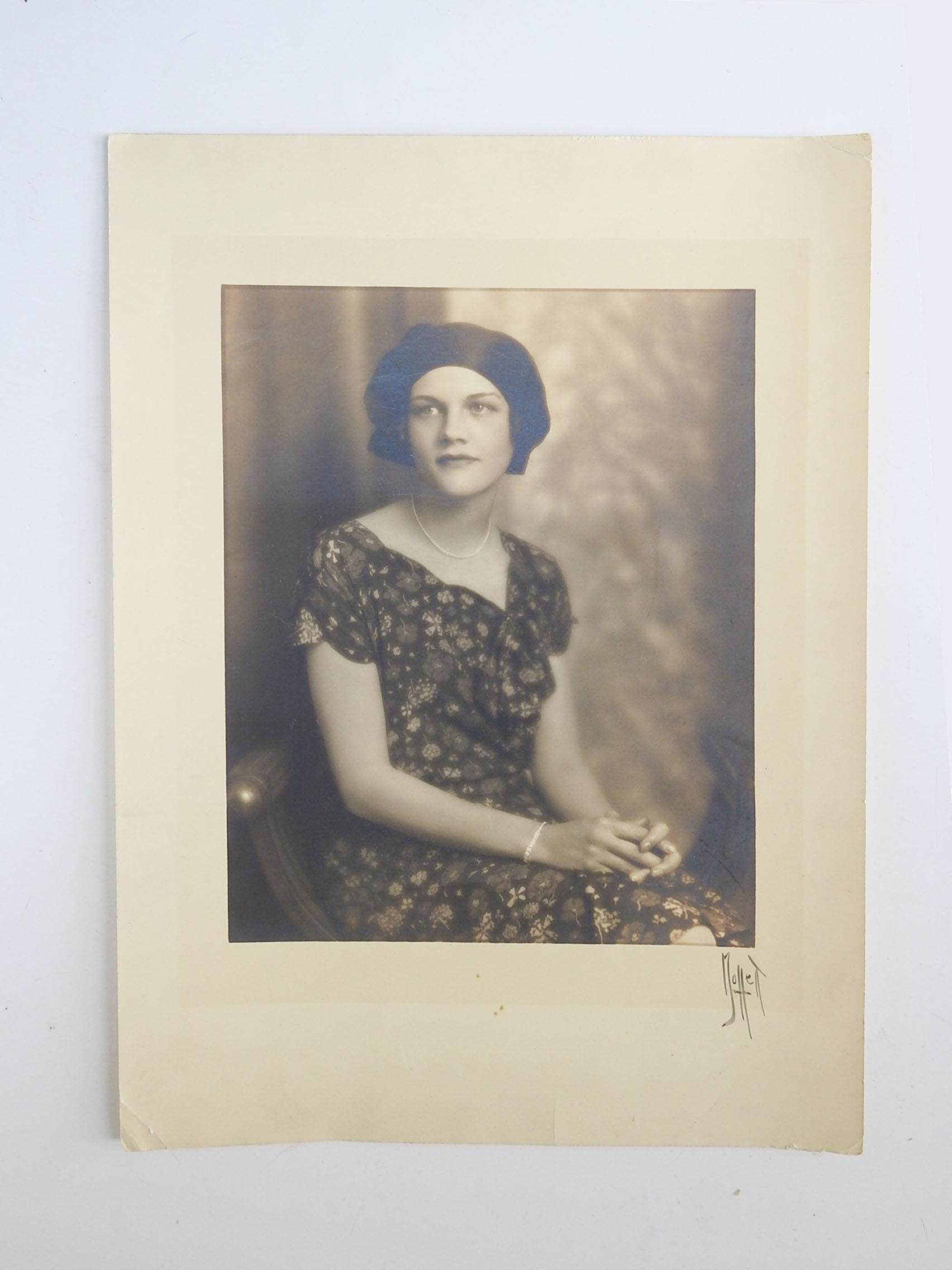 Vintage circa 1920's sepia toned portrait photograph of woman. Signed Moffett lower right margin. Unframed, small corner creases.