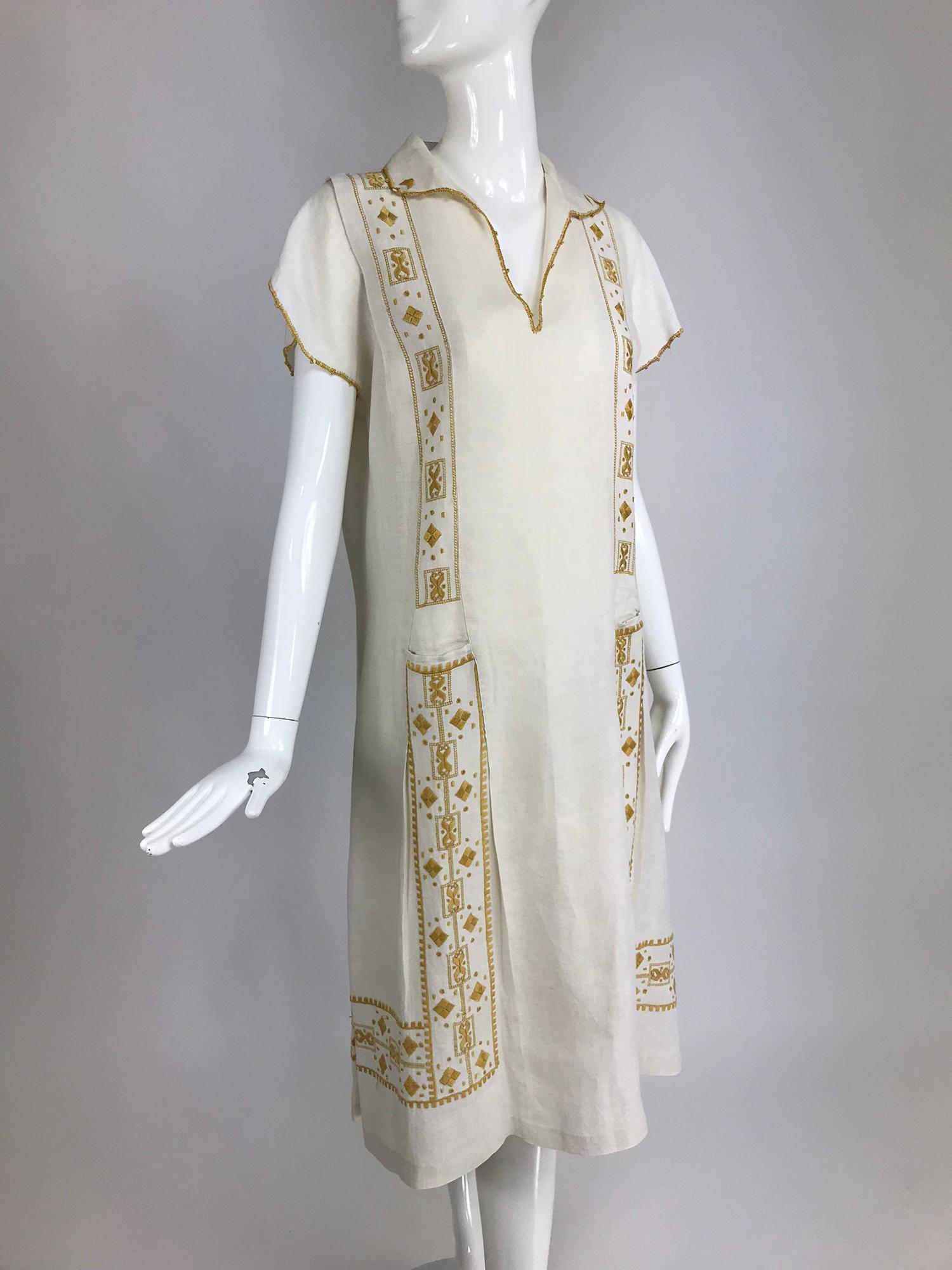 Vintage 1920s Hand embroidered Arts and Crafts linen day dress.The Arts and Crafts Movement of the early 20th century was a philosophy and way of life that encompassed all aspects of living, including home furnishings, publishing, and fashion. This