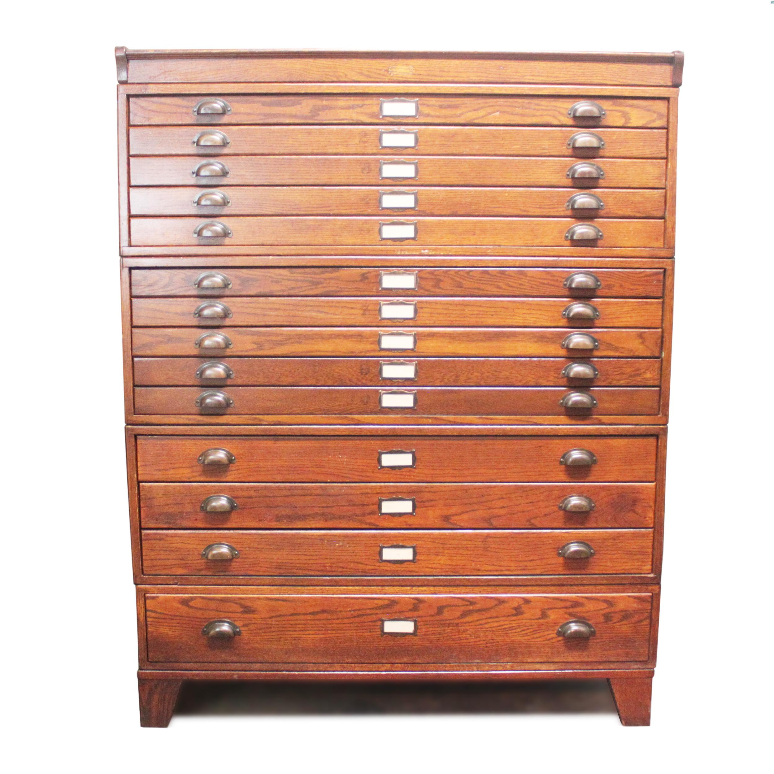 This amazing 1920s globe Wernicke cabinet features solid oak construction, panelled sides, original hardware, and re-conditioned original finish with a wonderful time-patinaed red hue. Cabinet consists of a base, (one) short, one-drawer section,