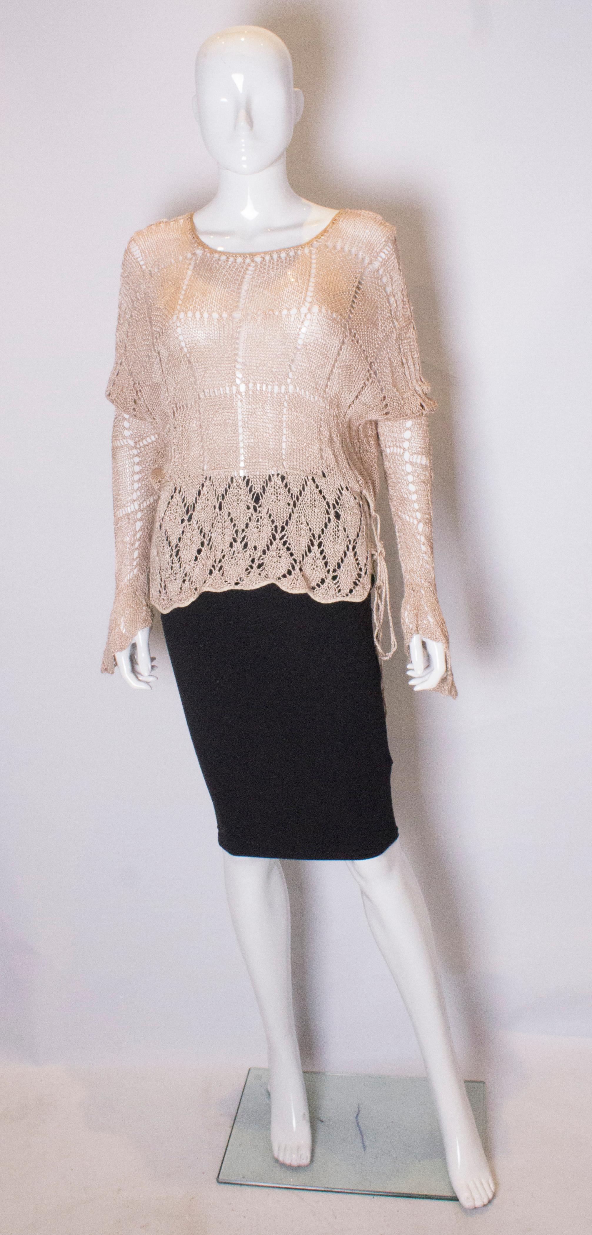 A stunning knit from the 1920s. This  beautiful jumper has a drawstring waist, round neckline and scalloped cuffs.
Measurements: bust up  to 38'',length 23''
