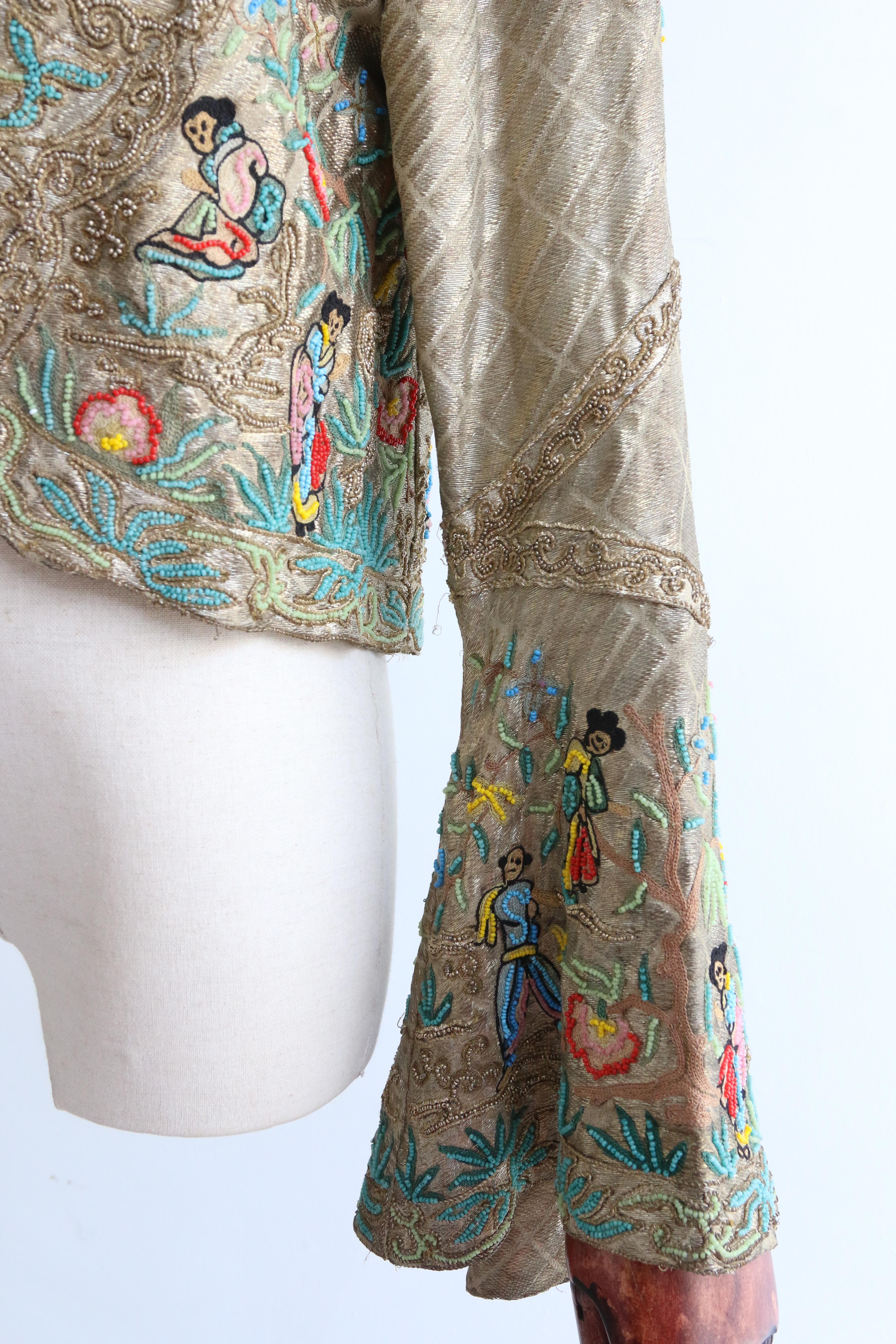 Full of opulent original details, rendered in the most luxurious fashion, this rare 1920's  gold lamé, beaded and embroidered jacket  is a beauty to behold and never again find.

The edge to edge cut of the jacket, boasts a rounded edge to the front