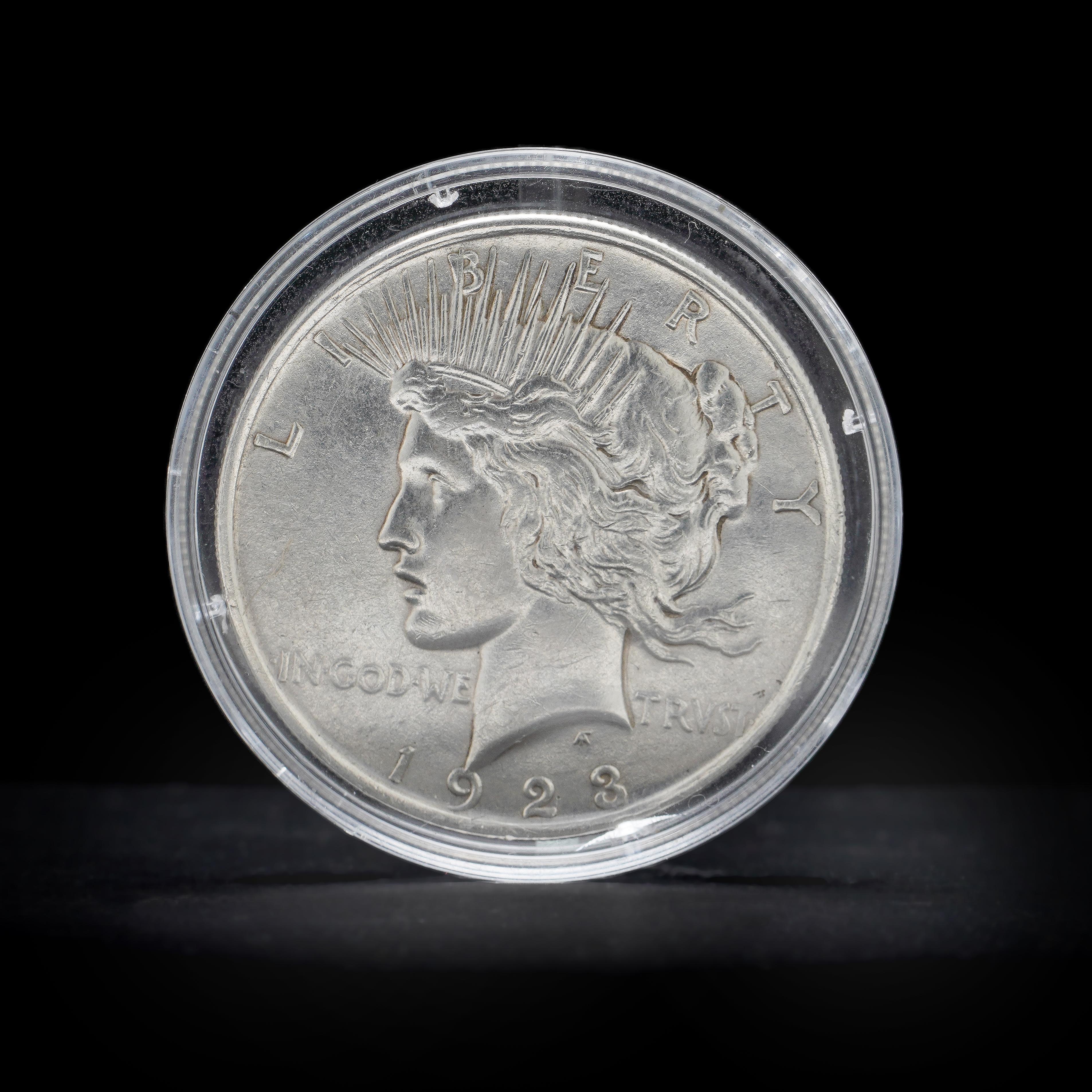 Vintage  1923 Peace Silver Dollar. 
Made in USA, 1923
Mint: Philadelphia
Comes with silver purity certificate. 

The obverse text on the Peace Dollar reads “Liberty; In God We Trvst (Trust); 1923.” The reverse text on the silver dollar reads “United