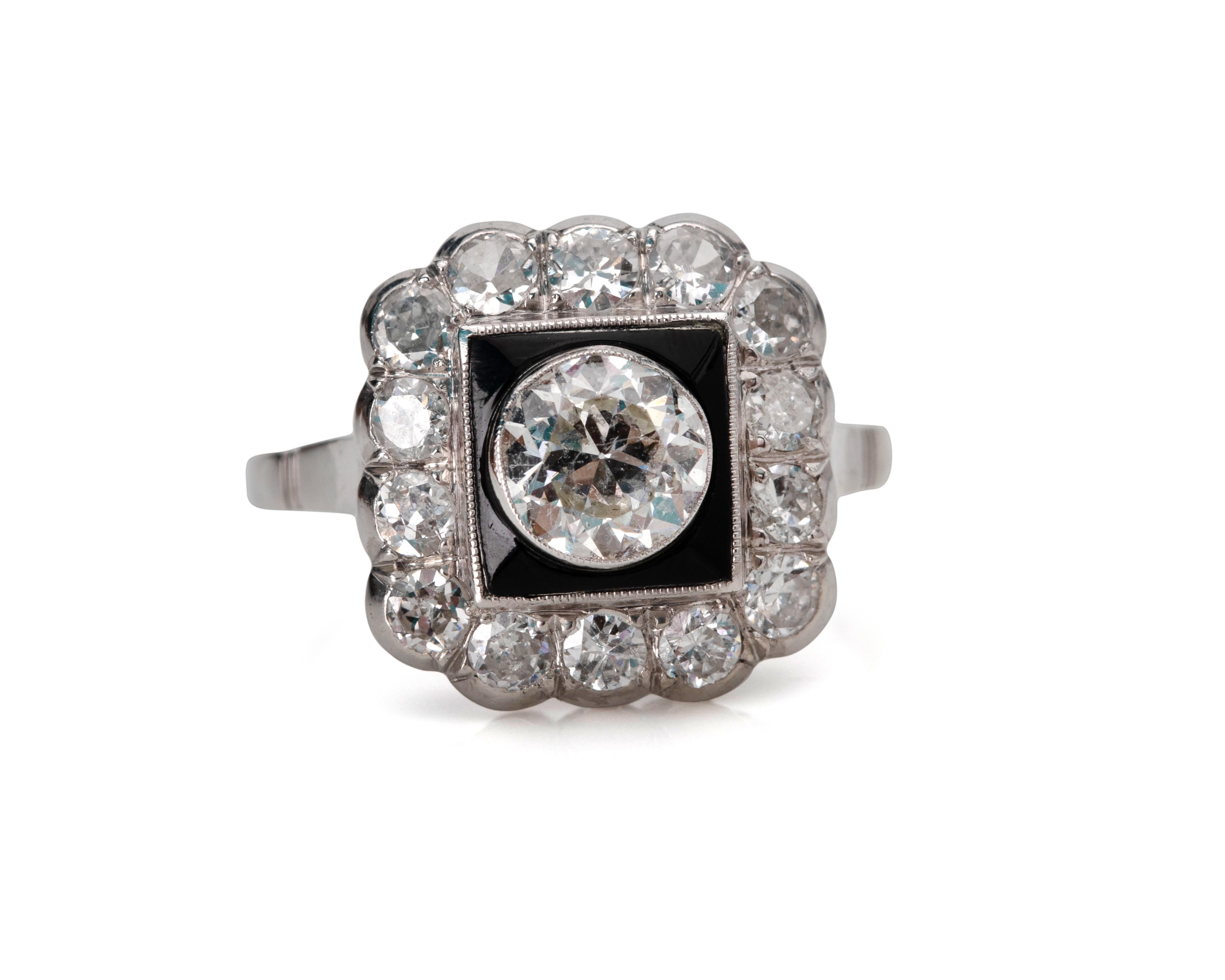 Here we have a excellent example of a late Art Deco style ring! This genuine 1940's ring features a brilliant .81 Carat Old European cut diamond bezel set in a very cool halo style ring. The ring utilizes black onyx for a added level of contrast to