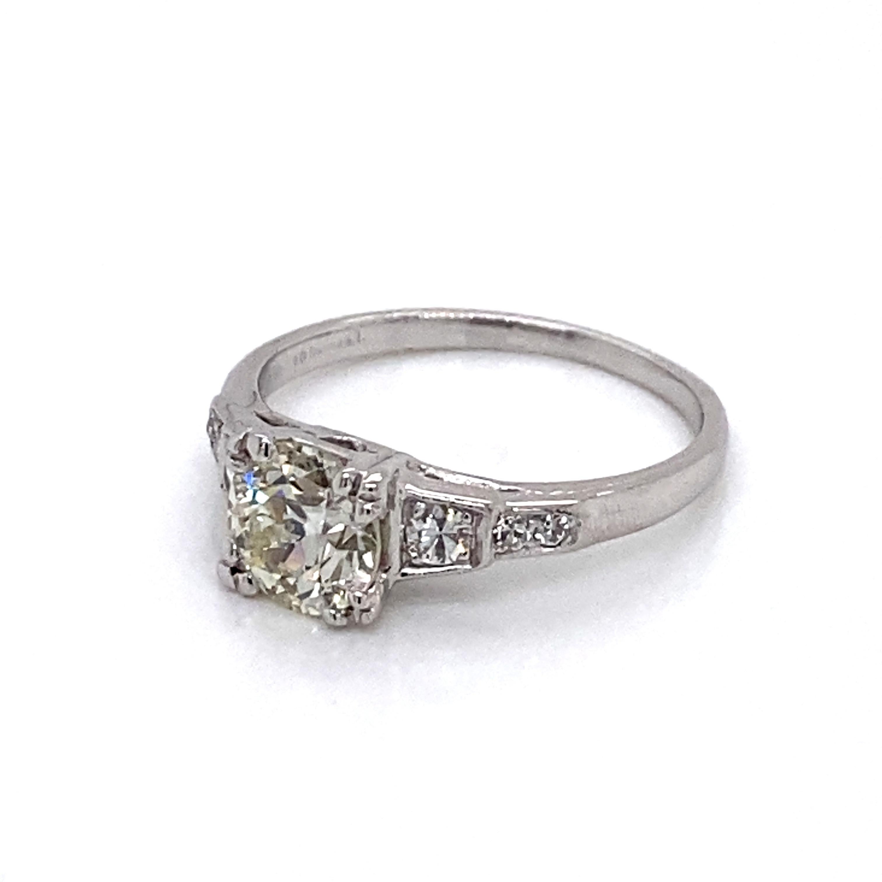 Vintage 1930s Art Deco European Cut Diamond Platinum Engagement Ring - The center diamond has a weight of 1.16ct, with K color, and VS2 clarity. The diamond sit low in an Art Deco platinum setting accented with 6 single cut diamonds. The side