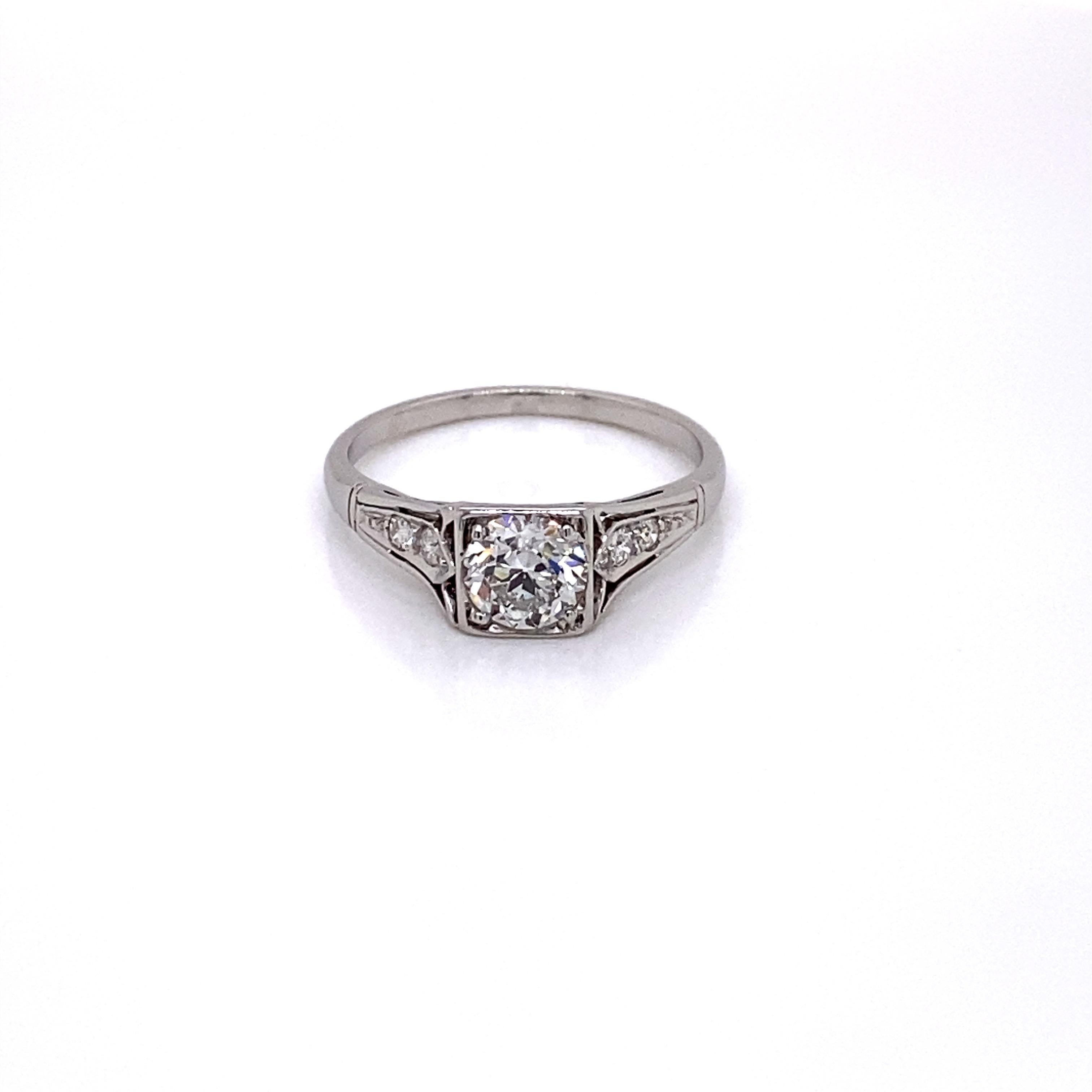 Vintage 1930s Art Deco Diamond Ring - The center European Cut diamond weighs .70ct and is H color and VS2 clarity. The diamond sits low in a platinum Art Deco square setting with beautiful heart shape and circle filigree workmanship in the gallery.