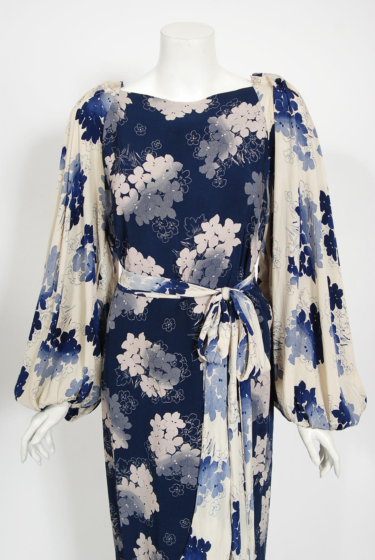 A simply stunning late 1930's Arthur Weiss designer dress fashioned in a beautiful gradient blue and ivory floral silk. The print alone is so striking! Arthur Weiss has been noted as being the largest maker of dresses in the United States during
