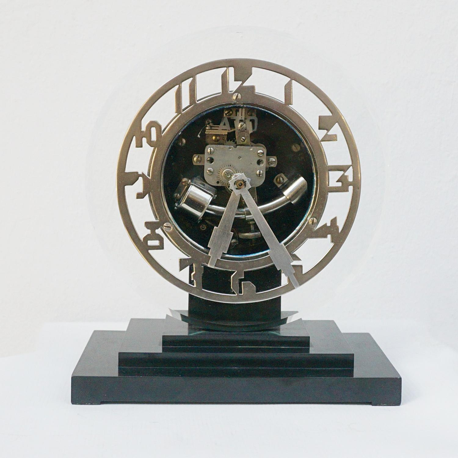 An Art Deco mantel clock by Leon Hatot Fabricants, Paris. Glass fronted with chrome numerals and dials. Set over a stepped bakelite base. 

Dimensions: H 23cm W 19cm D 11cm

Origin: France

Date: Circa 1930

Item Number: 1901232