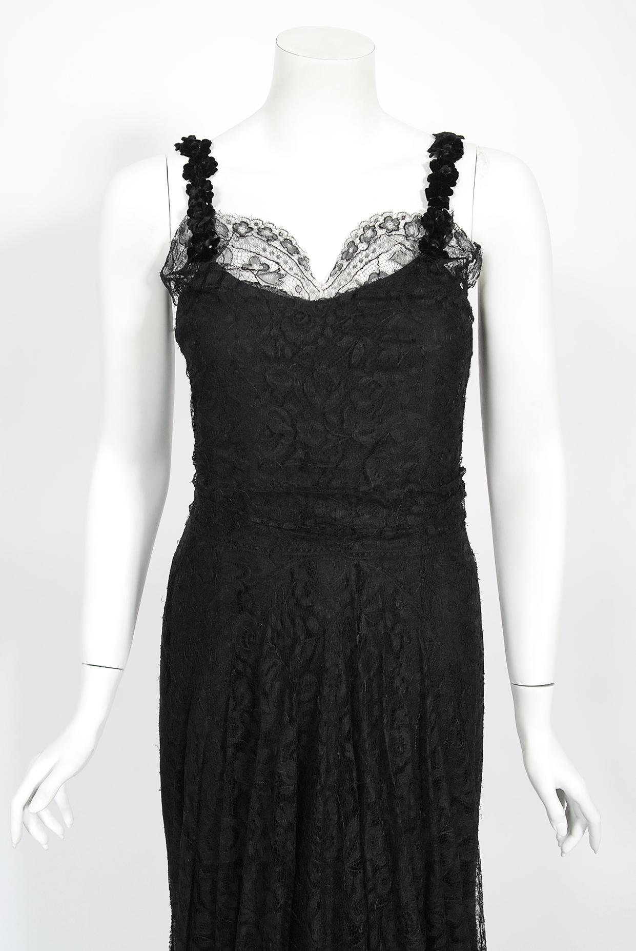 A magnificent Bonwit Teller & Co couture black lace bias-cut gown from the 1930's 'Old Hollywood' era of glamour. The fabric itself is a masterpiece; French floral motif black scalloped lace that has been draped to perfection. We added many pictures