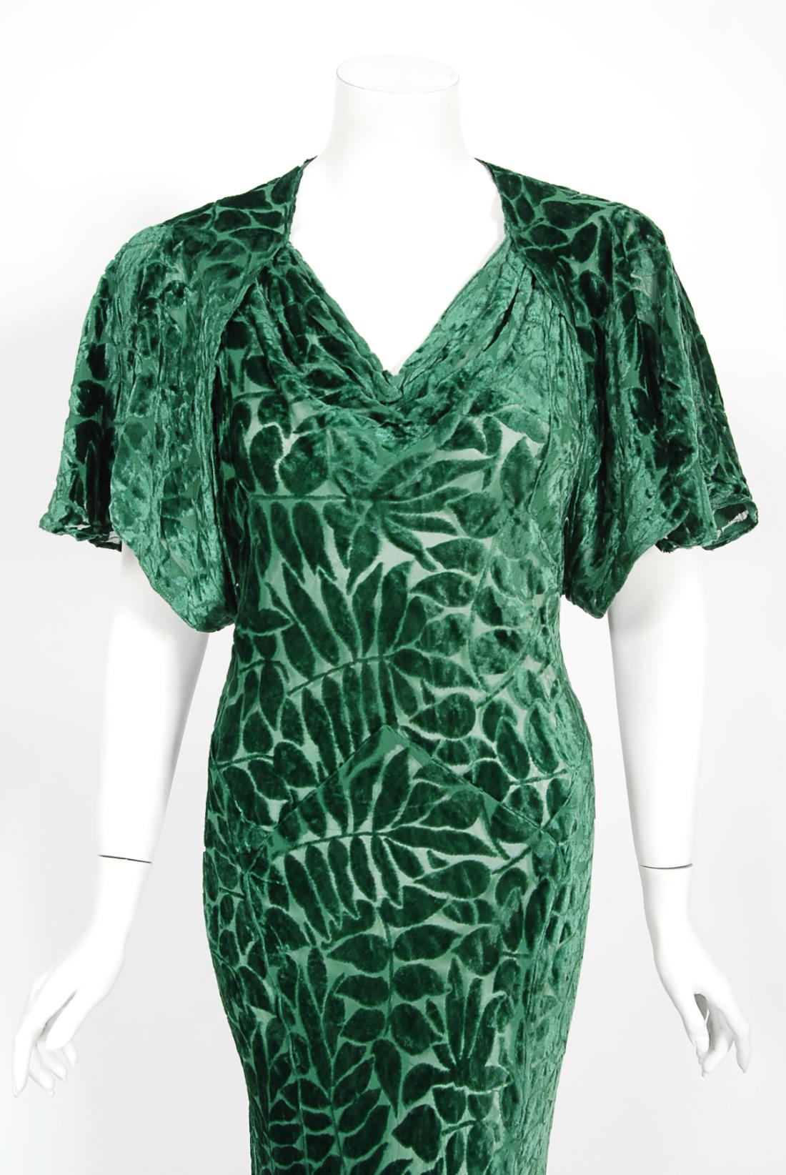 A truly breathtaking and ultra glamorous mid 1930's emerald green devore silk velvet bias cut gown from the high-end London department store Debenham & Freebody. This special department store became the first of over 60 nationwide. Finding early
