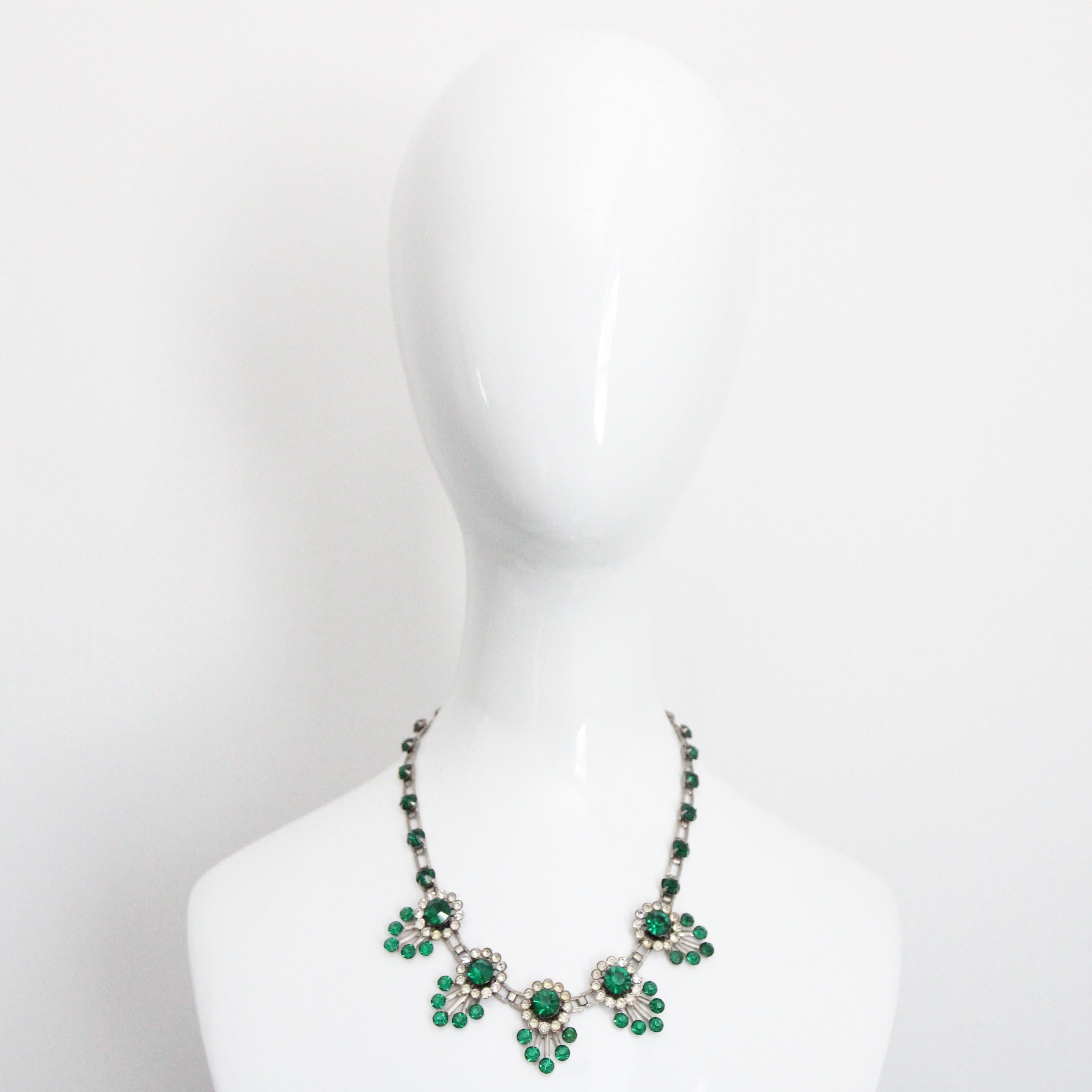 This truly mesmerising 1930's rhinestone embellished necklace, constructed on a silver toned link chain, which boasts small carved filigree details, is the perfect touch of sparkle to complete your outfit. The rectangular links of the necklace are
