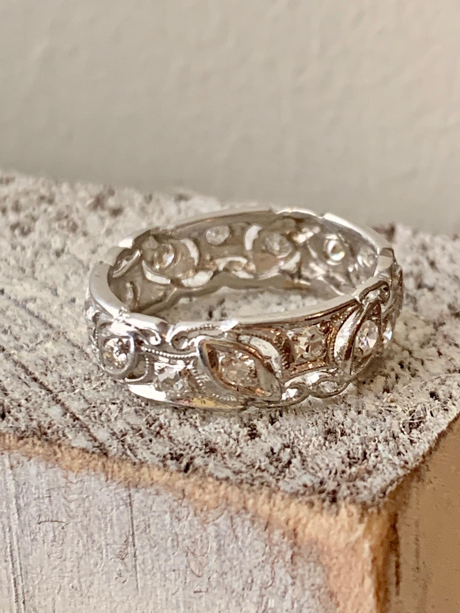 This wedding or anniversary eternity band is simple, but makes a bold statement.  

The ring has:
15 Single cut and European cut Diamonds - approximately .60 ctw with average grades of SI-G.

Size: 6

Weight: 3.9 grams

This ring is in excellent