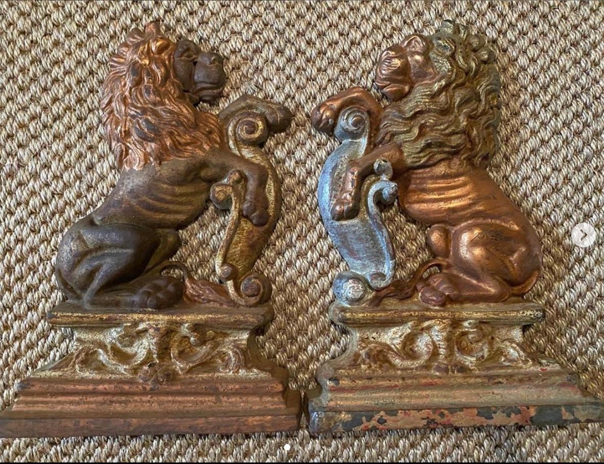 A pair of French painted cast iron doorstops or bookends in the form of heraldic lions, circa 1930s and retaining the original painted and gilded finish.

The lion is a common image used in heraldry. It traditionally symbolizes courage, nobility,