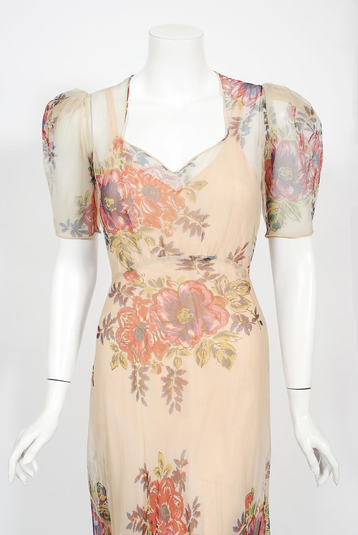 There are lots of lovely 1930's garments still around, but every once in a while I come across one that sets my heart a flutter! This is a simply beautiful 1930's colorful large-scale floral print sheer silk net gown with matching nude under slip.