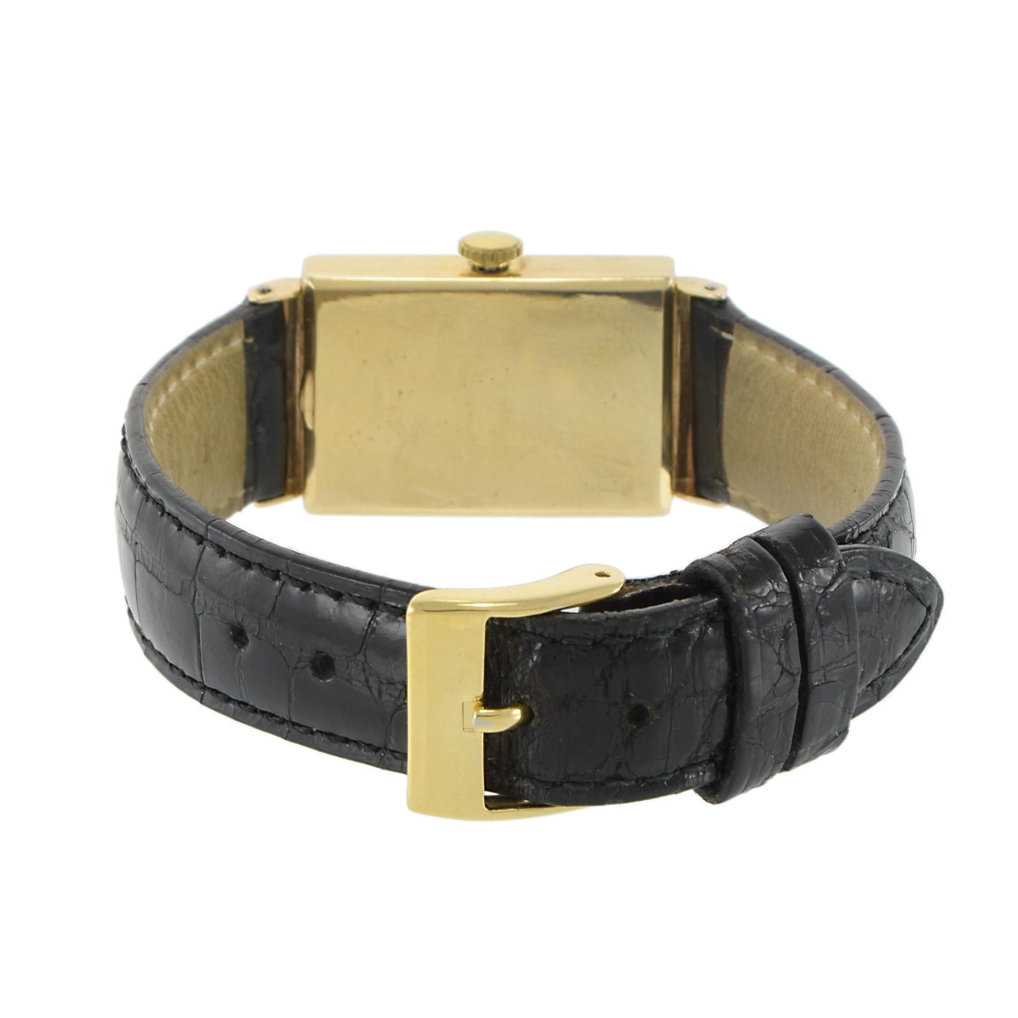 A refined 1930s LeCoultre dress watch, featuring a 20x29mm 14K yellow gold case with distinctive full lugs, embodying the elegance of early 20th-century design. The white dial is adorned with raised gold stick and Roman numeral markers, complemented