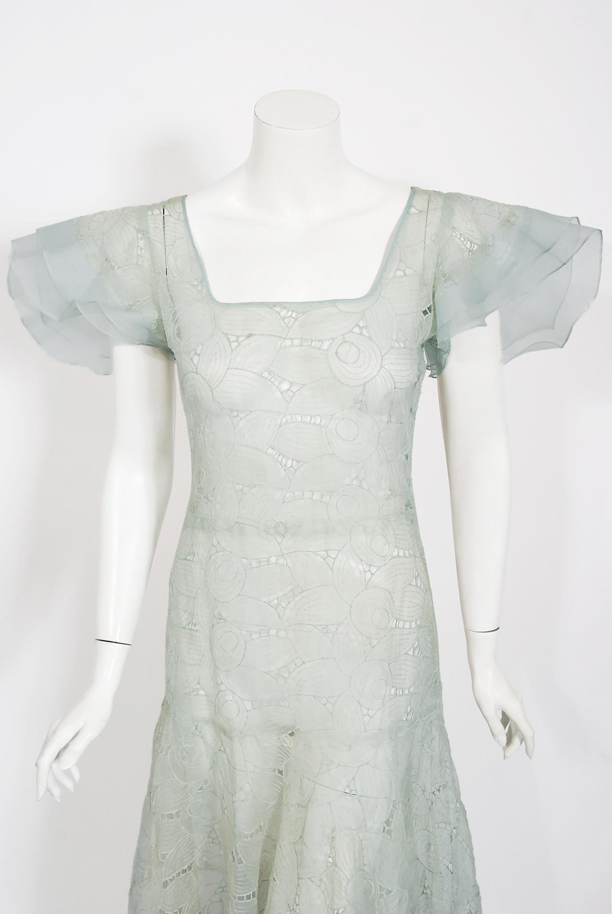 There are lots of lovely 1930's garments still around, but every once in a while I come across one that sets my heart a flutter! This is a simply beautiful 1930's light sky-blue sheer embroidered organza gown. The deco floral embroidery is really