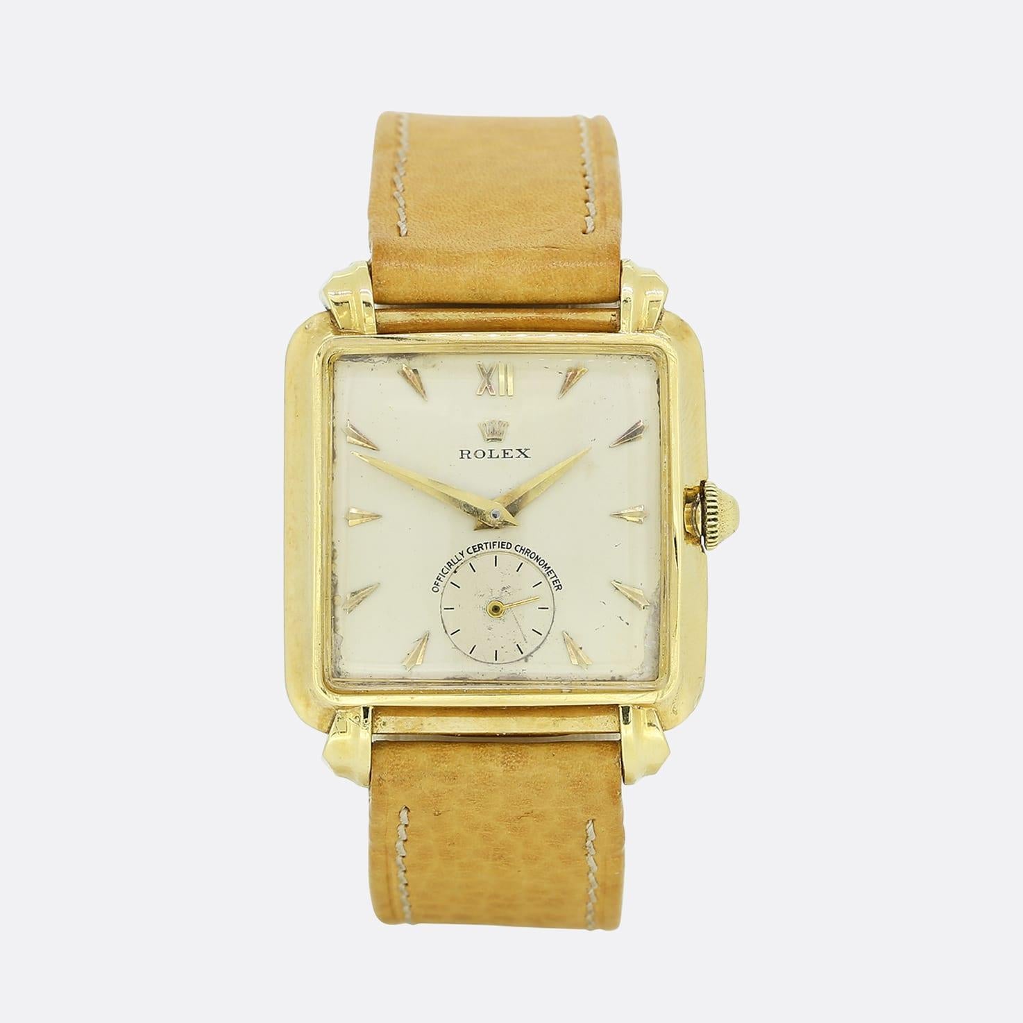 This is an 18ct yellow Rolex Officially Certified Chronometer from the 1930's. The watch has an 18ct yellow gold square case, a cream dial with gold hour markers and Roman numerals at 12 o'clock. The case has the initials EF engraved on the back but