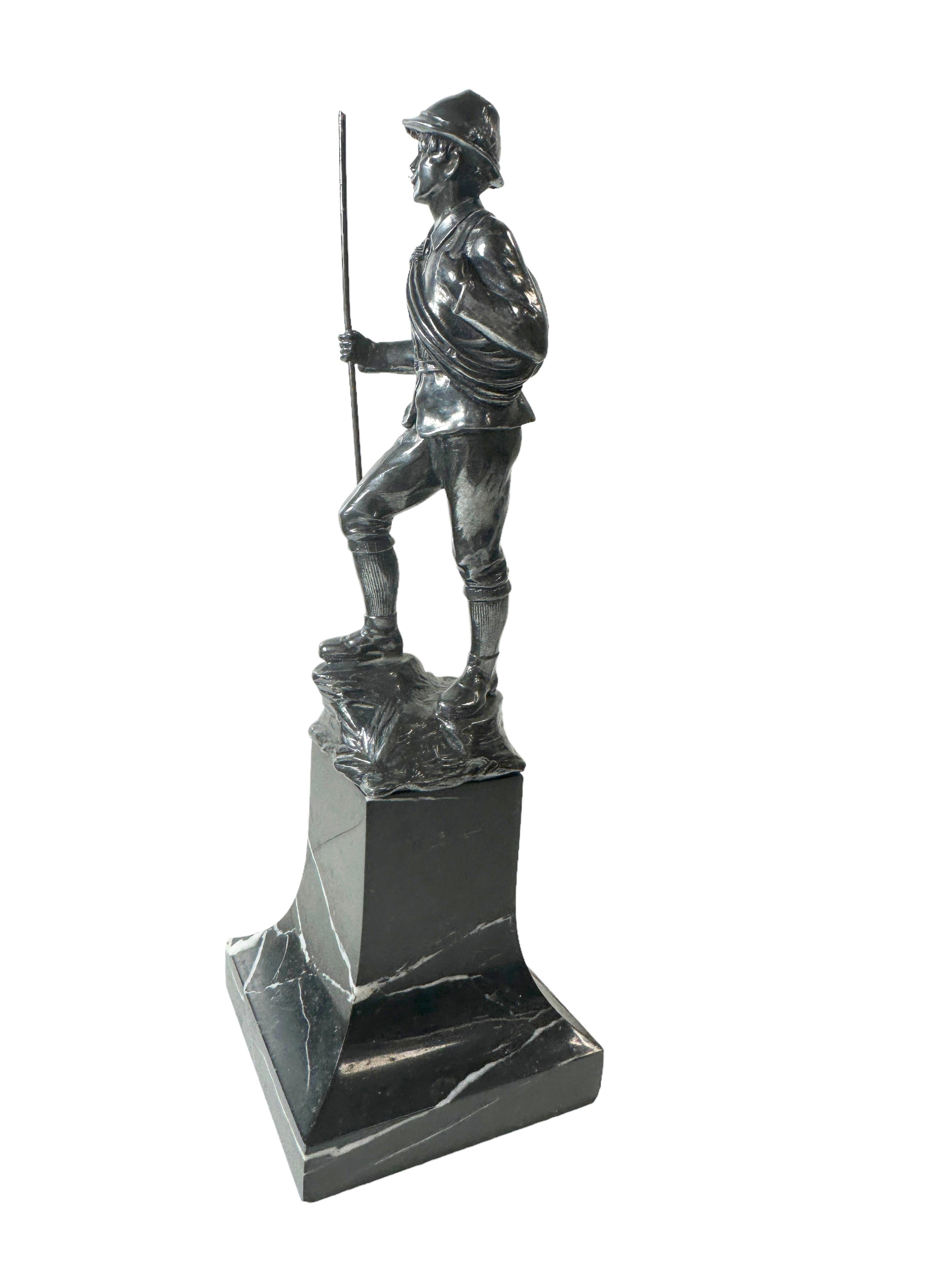 A classic decorative metal statue. Some wear with a nice patina, but this is old-age. Made of metal, fixed on a marble base. It is a nice and beautiful sculpture of Mountain Climber. Found at an estate sale in Vienna, Austria. A nice addition to any