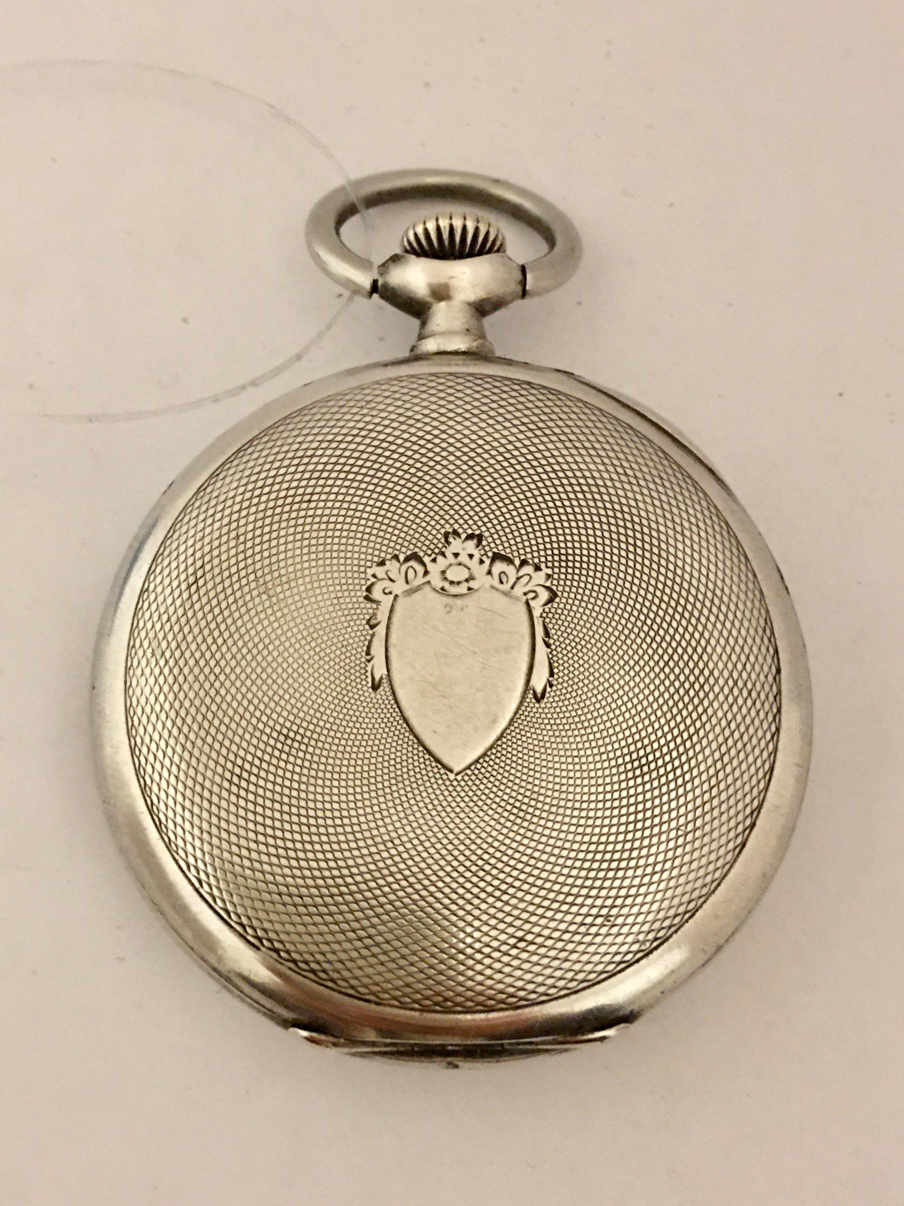 This Charming 49mm Antique Omega Silver Pocket Watch is working and it is ticking well. However due to its age I cannot guarantee its time accuracy ( it runs 10mins fast a day) Visible signs of wearing on the silver case, some tiny dents on the back