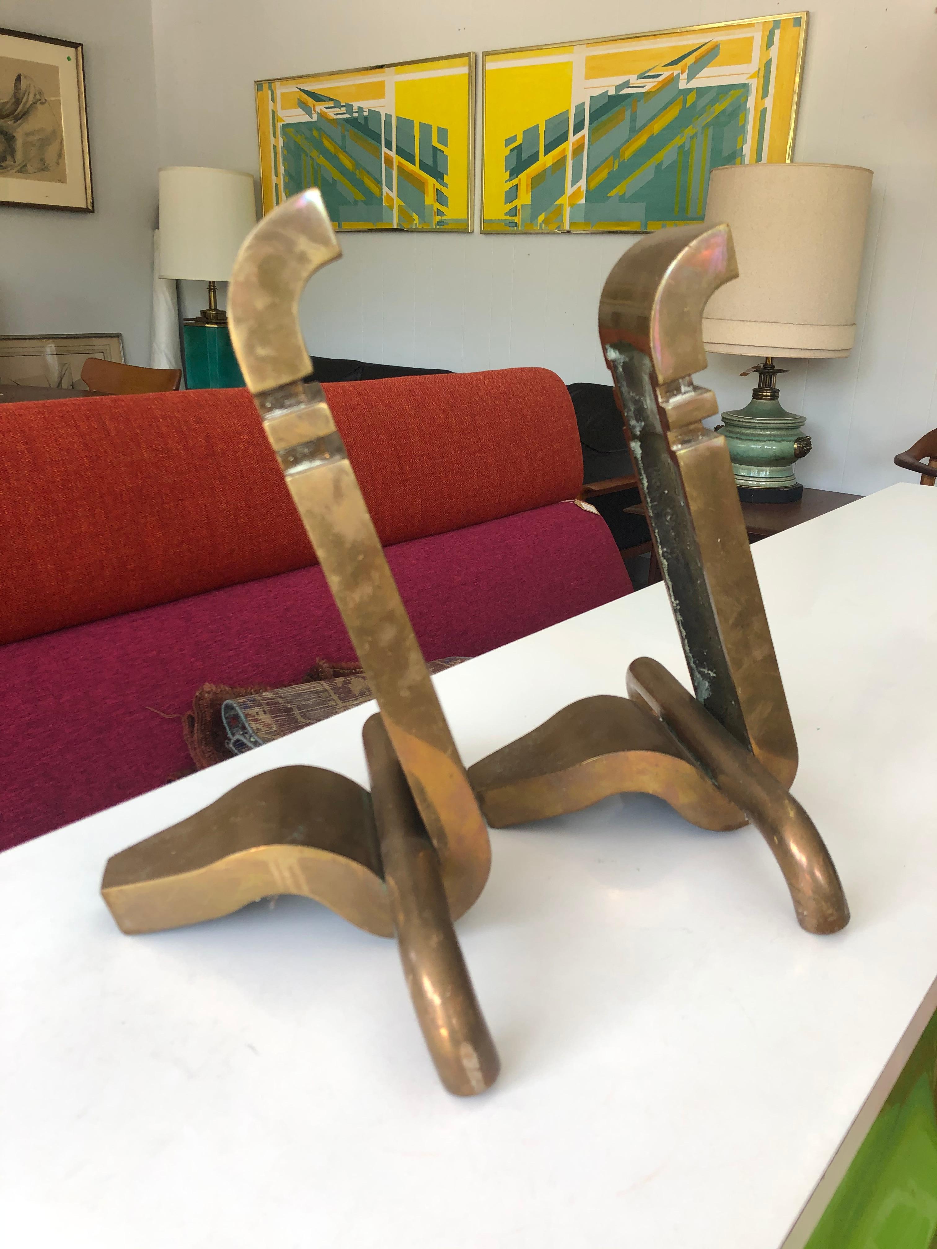 This pair of vintage Machine Age bronze andirons are stunning, and would compliment every fireplace. Great Patina. Very heavy, and well crafted. Designer/Maker unknown. 
circa 1930s.
Dimensions:
14.5