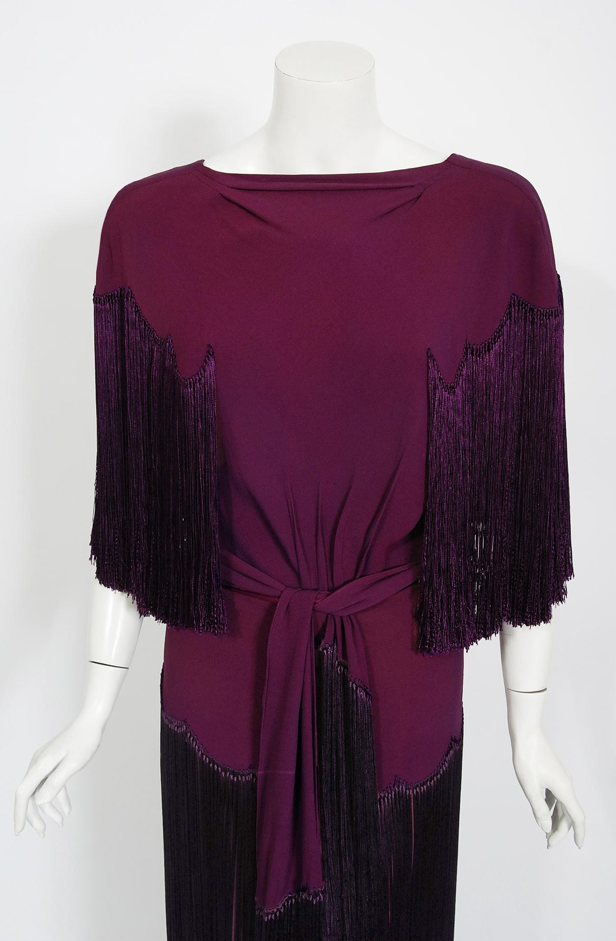 A breathtaking late 1930's custom-made plum purple silk crepe gown from the Old Hollywood era of glamour. There is so much detail, you can tell this masterpiece was created with love and care. The bodice has an alluring sculpted high neck with
