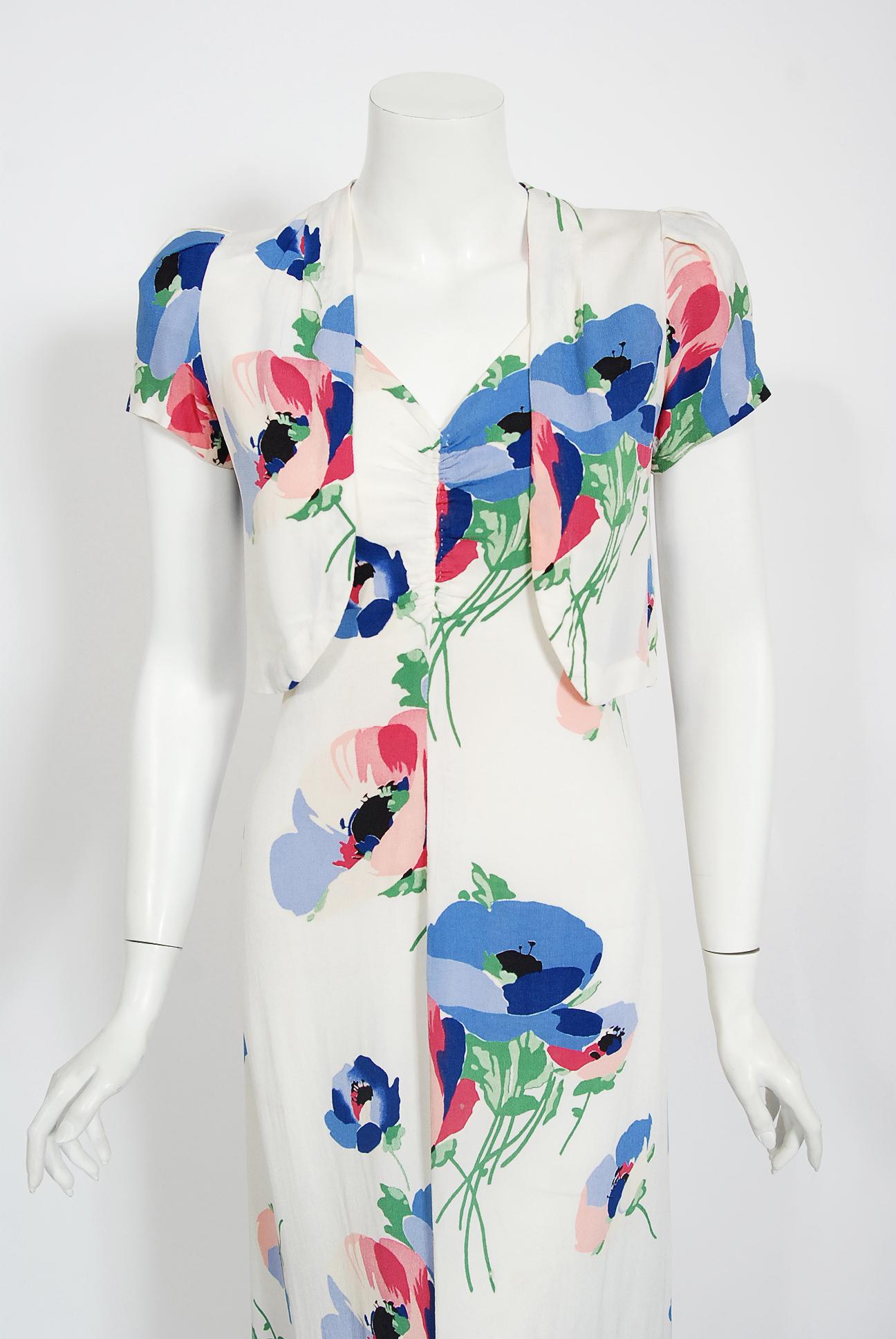There are lots of lovely 1930's garments still around, but every once in a while I come across one that sets my heart a flutter! This is a simply beautiful 1930's summertime colorful floral white rayon-crepe dress ensemble. The over-sized poppy