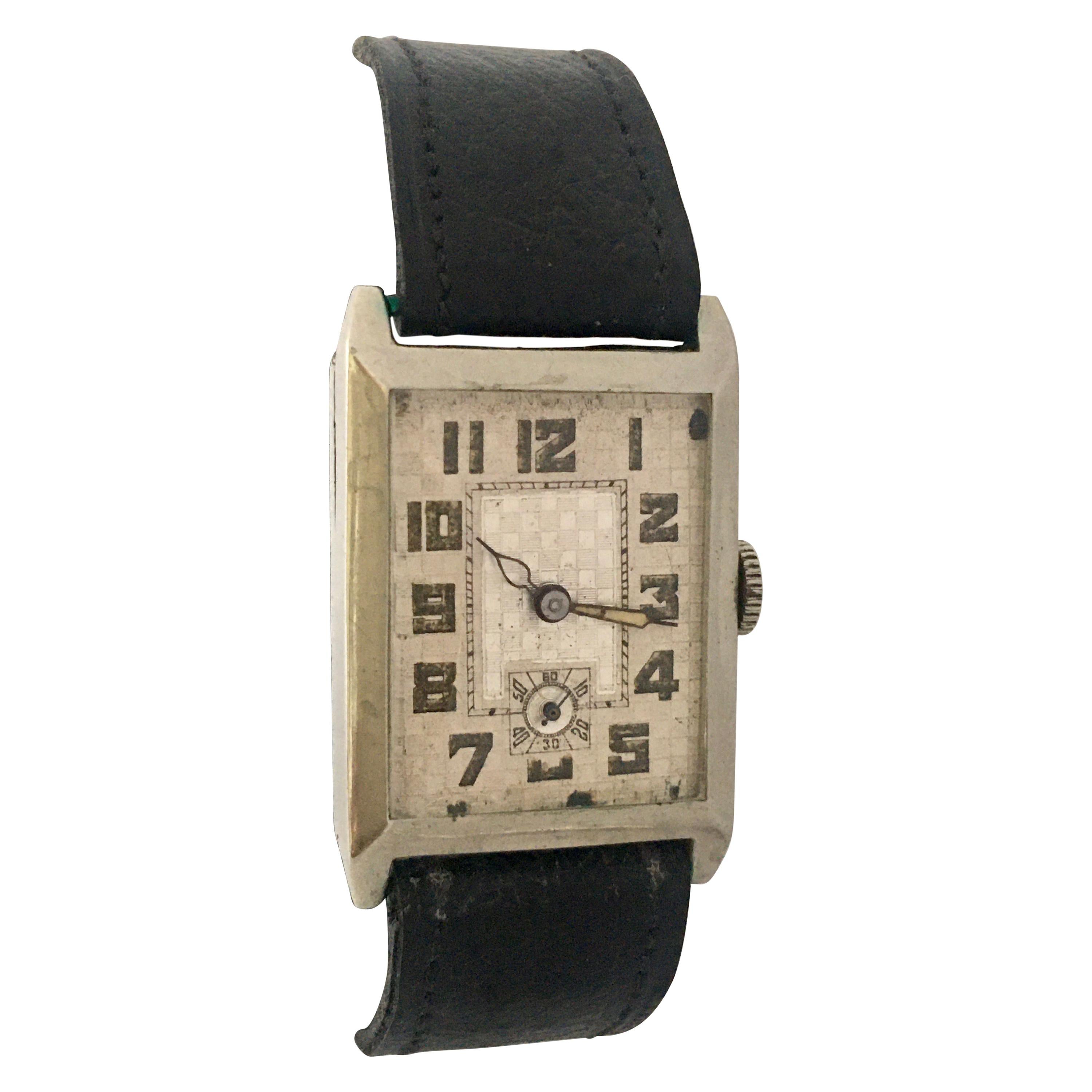 This beautiful vintage hand winding watch is working and it is ticking well. Visible signs of ageing and wear with tiny and light scratches on the watch case as shown. Watch case dimensions are 40mm long and 23mm wide excluding the crown. 

Please