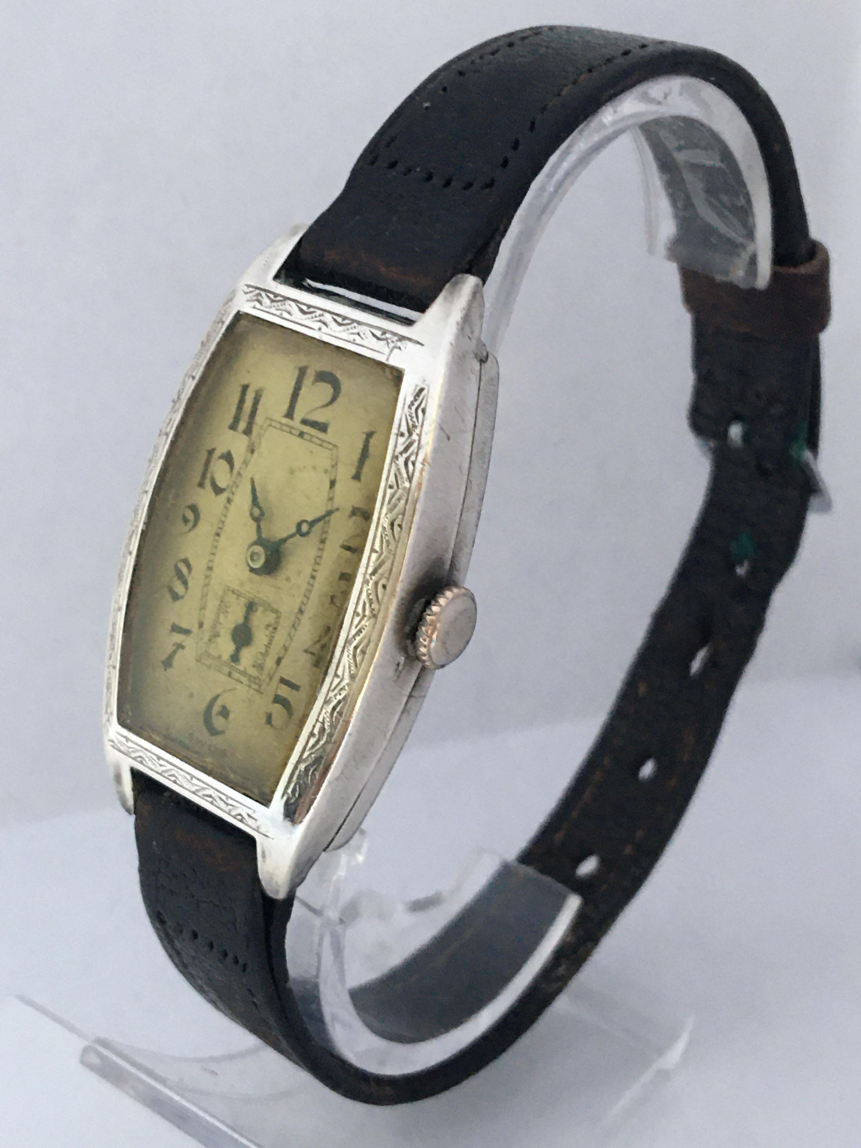 This beautiful pre-owned vintage watch is in good working condition and it is ticking well. Visible signs of ageing and wear with light scratches on the glass and on the silver case. The silvered watch dial is a bit worn. Some small dents on the