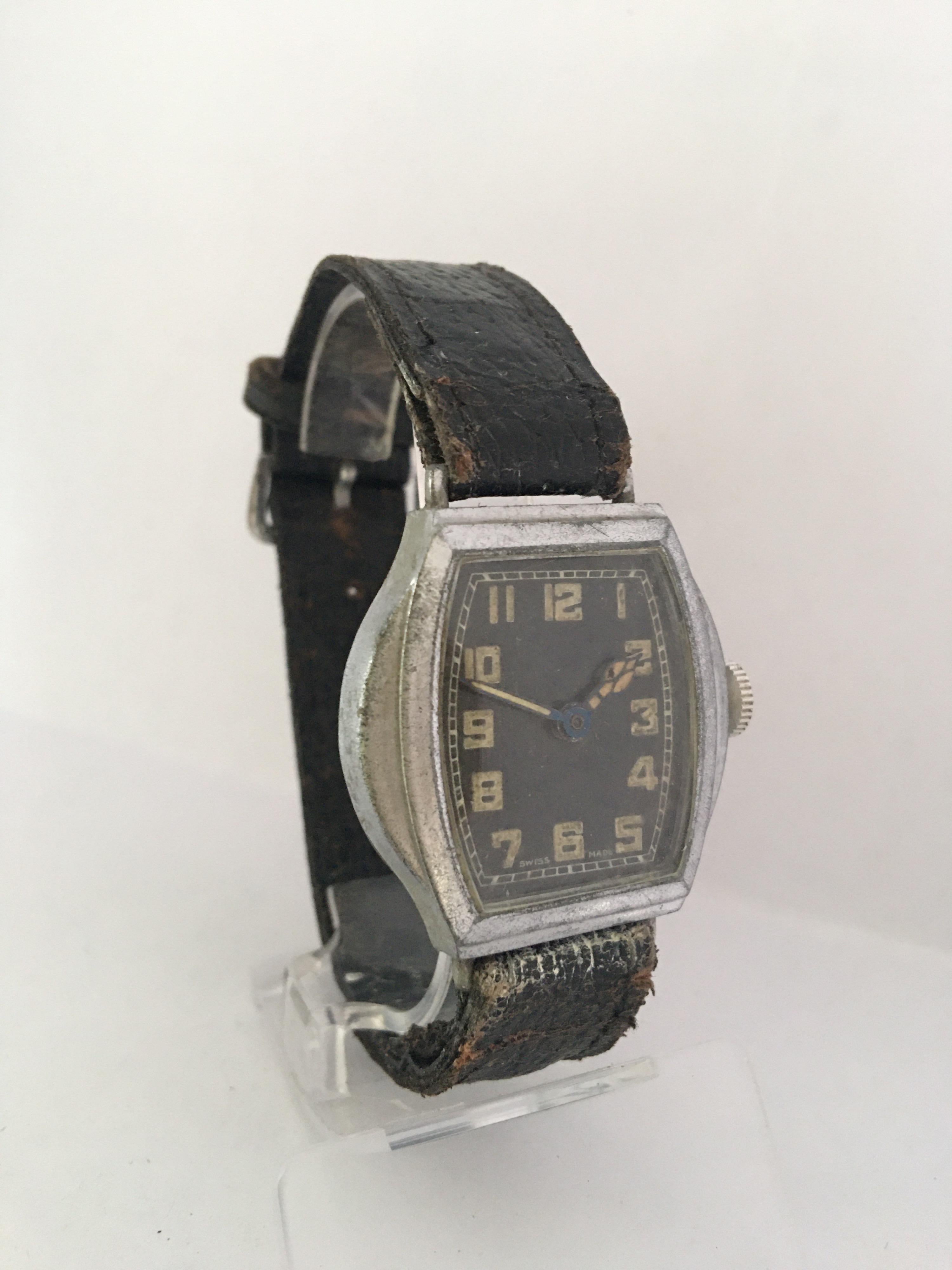 This pre-owned vintage hand winding watch is working but it keep stopping. It probably need a service. Visible signs of ageing and wear with light marks on the glass . The chrome plated metal base case has aged and is tarnished as shown. An old