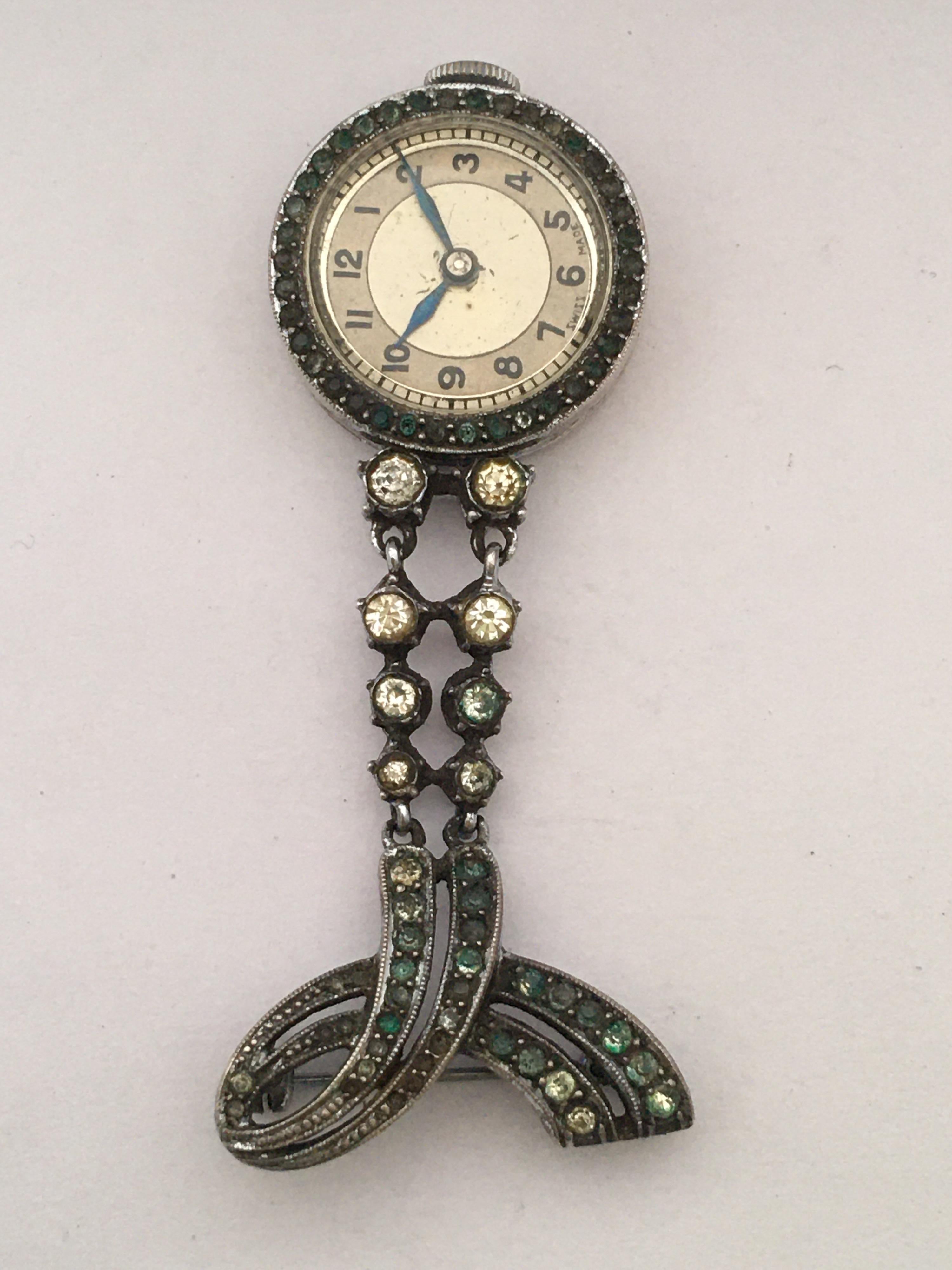 This beautiful vintage hand winding nurse’s watch is in good working condition and it is ticking well. It is recently been serviced and runs well. Visible signs of ageing and wear with light scratches and tarnishes on the watch case as shown. Some