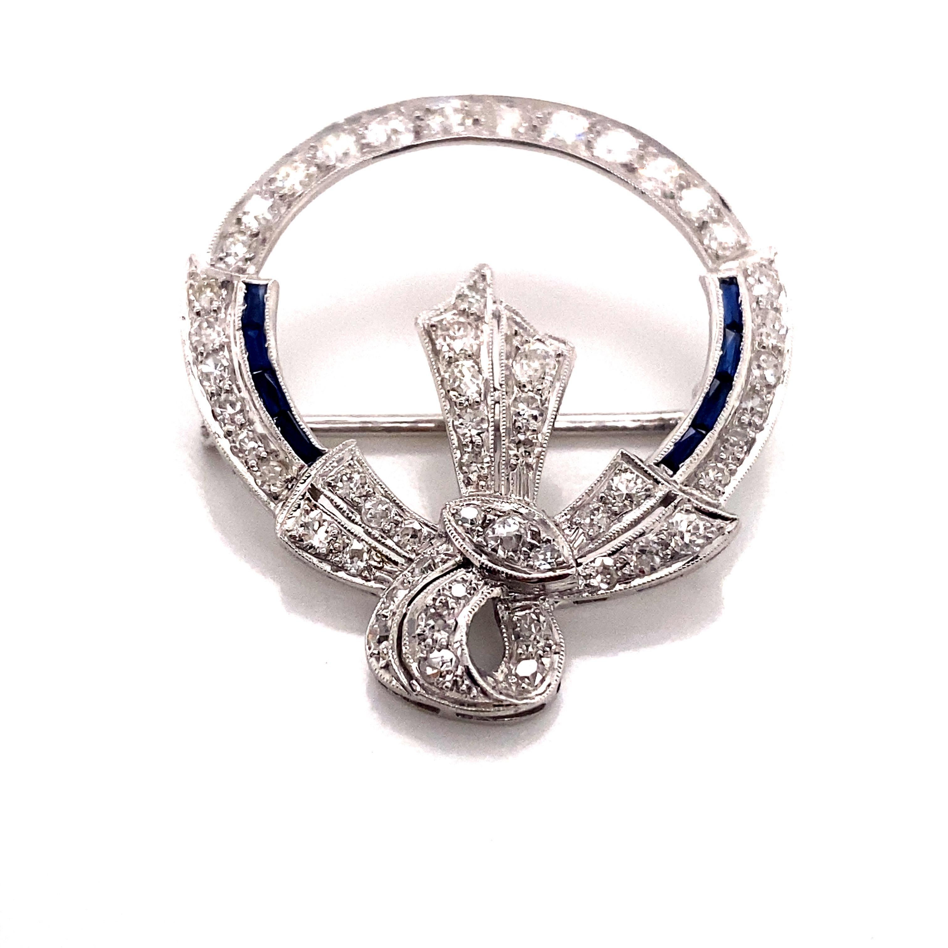 Vintage 1930’s White Gold Diamond and Sapphire Wreath Pin - The wreath contains 53 Old European and single cut diamonds that weigh approximately 1.50ct total weight. The diamond quality is H - I color, and VS1 - I1 clarity. The diamonds are hand set