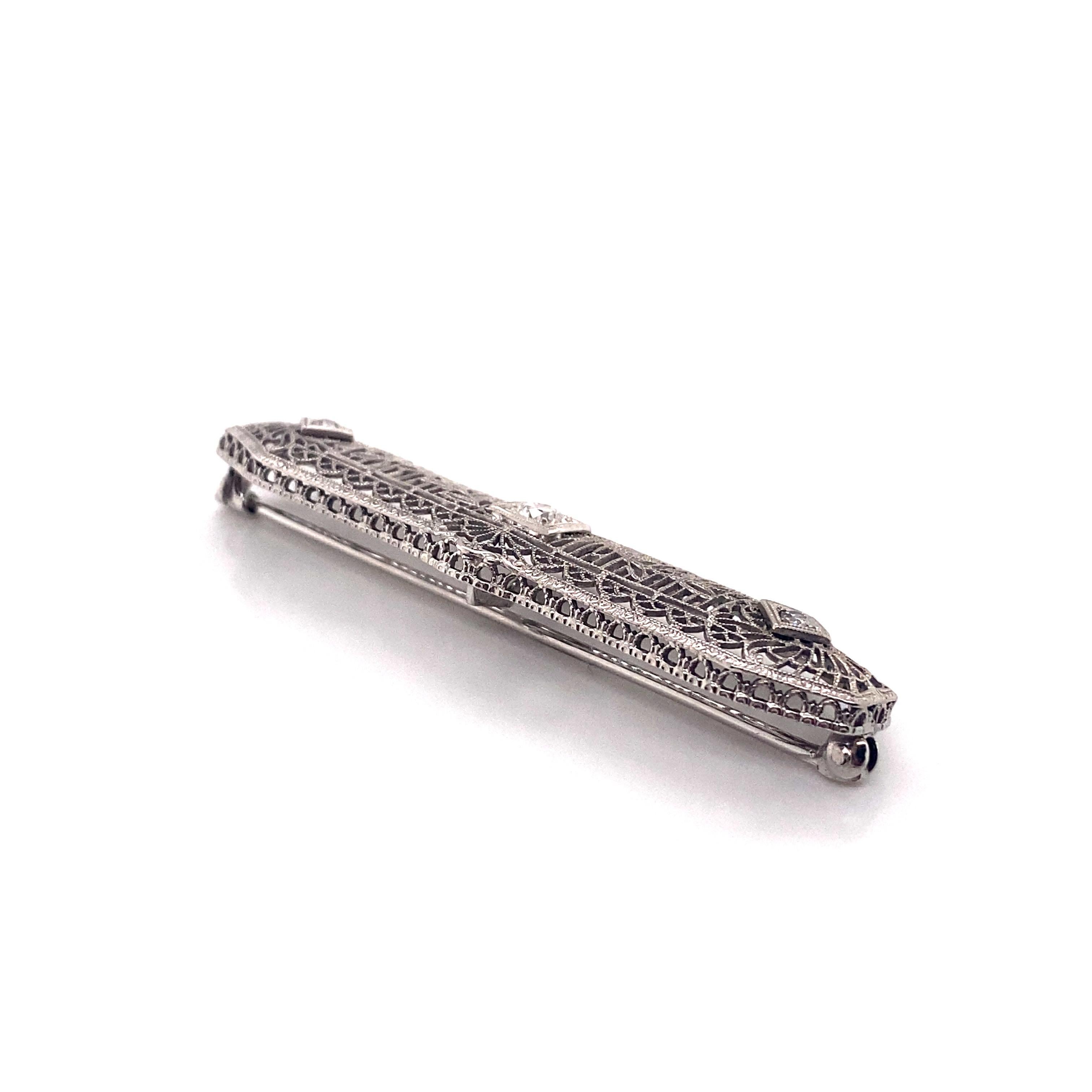 Art Déco Spilla vintage anni '30 in platino filigranato con diamante a barretta