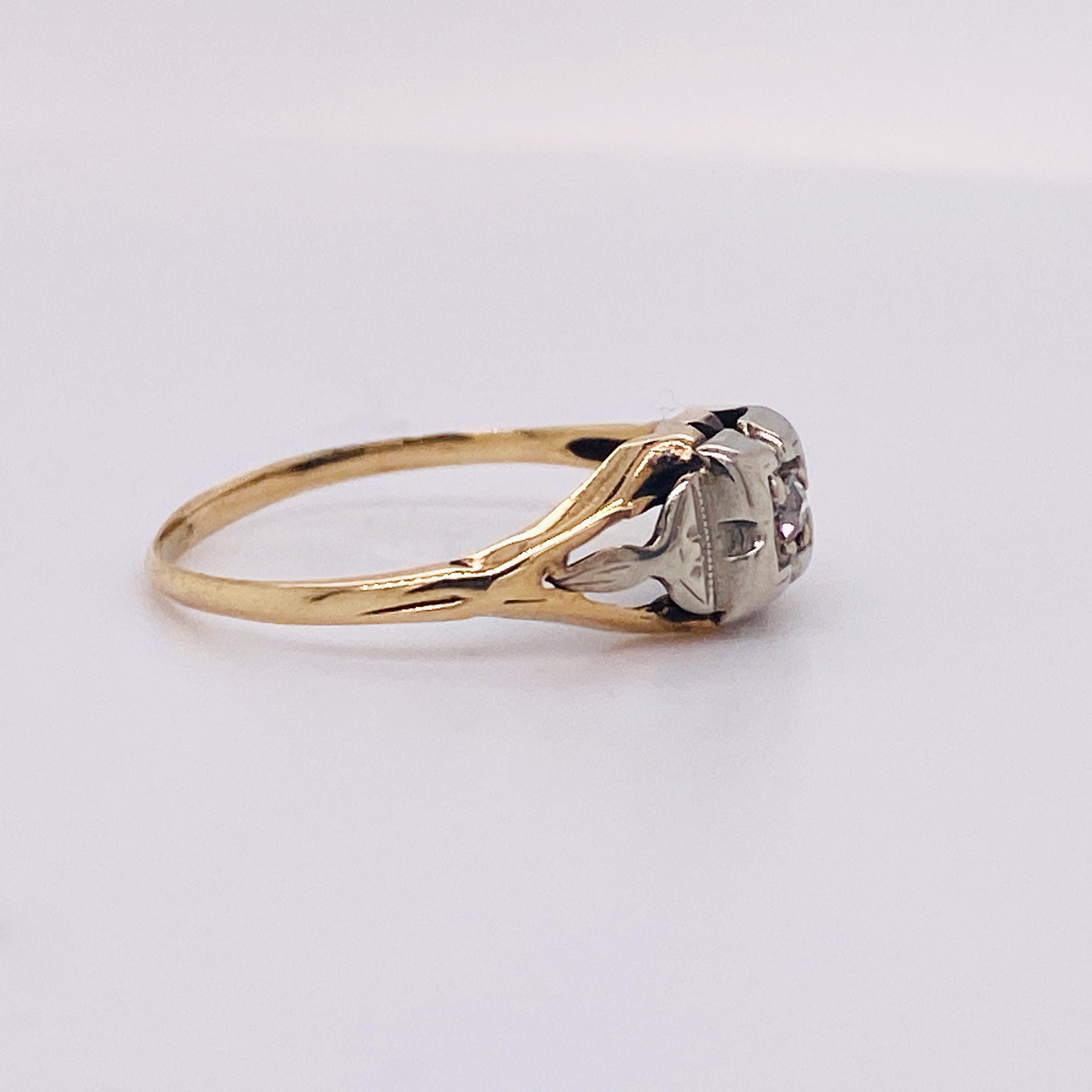 This vintage beauty is is the perfect ring for lovers of 1930s charm. A sweet old mine cut diamond is held at the raised center of the four prong top accented with floral details. The white gold centerpiece tapers and merges with yellow gold split