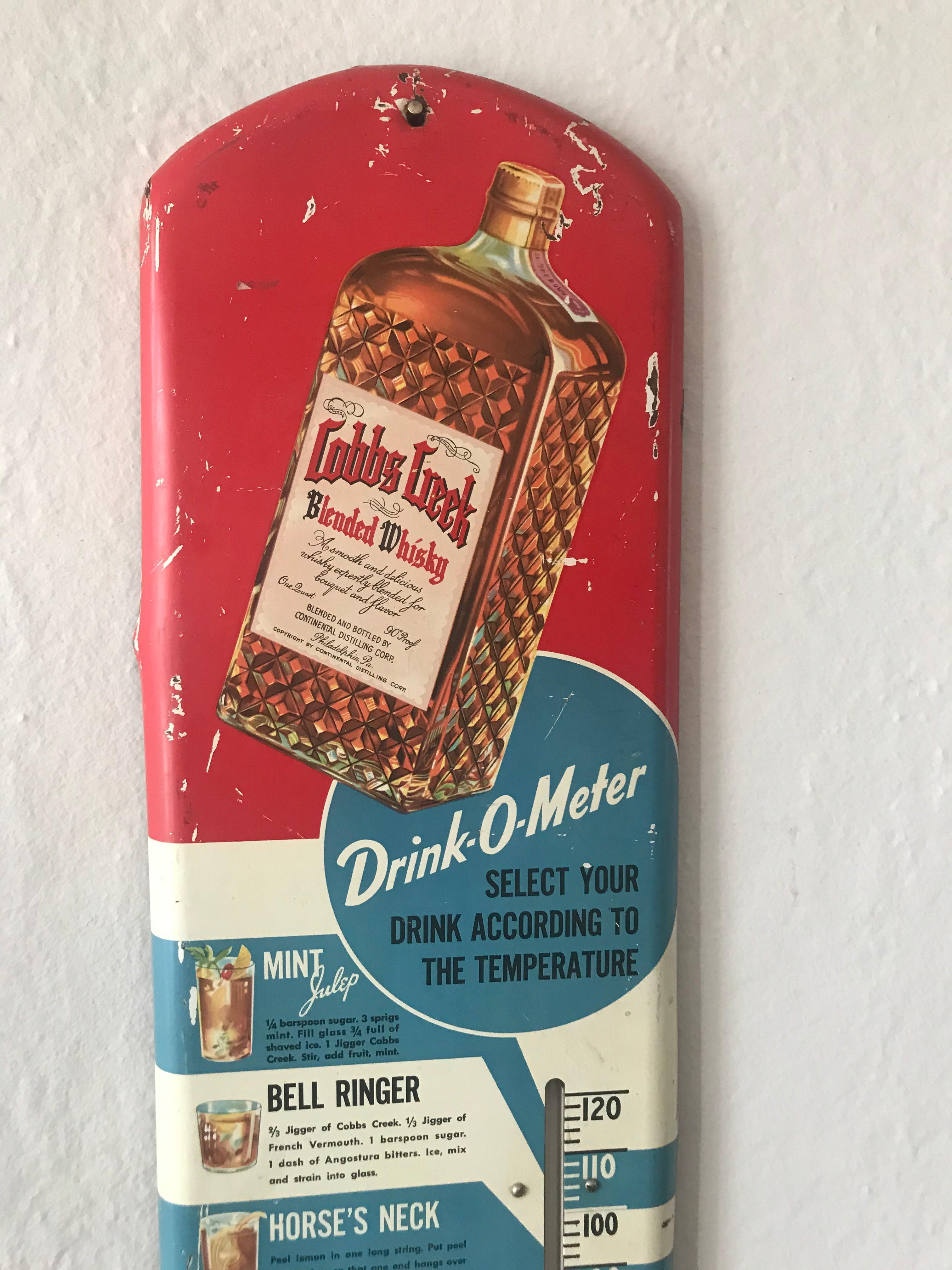 Vintage 1936 Cobbs Creek Blended Whisky metal advertising thermometer/sign. Whiskey was made by the Continental Distilling Corporation in Philadelphia, Pennsylvania. 