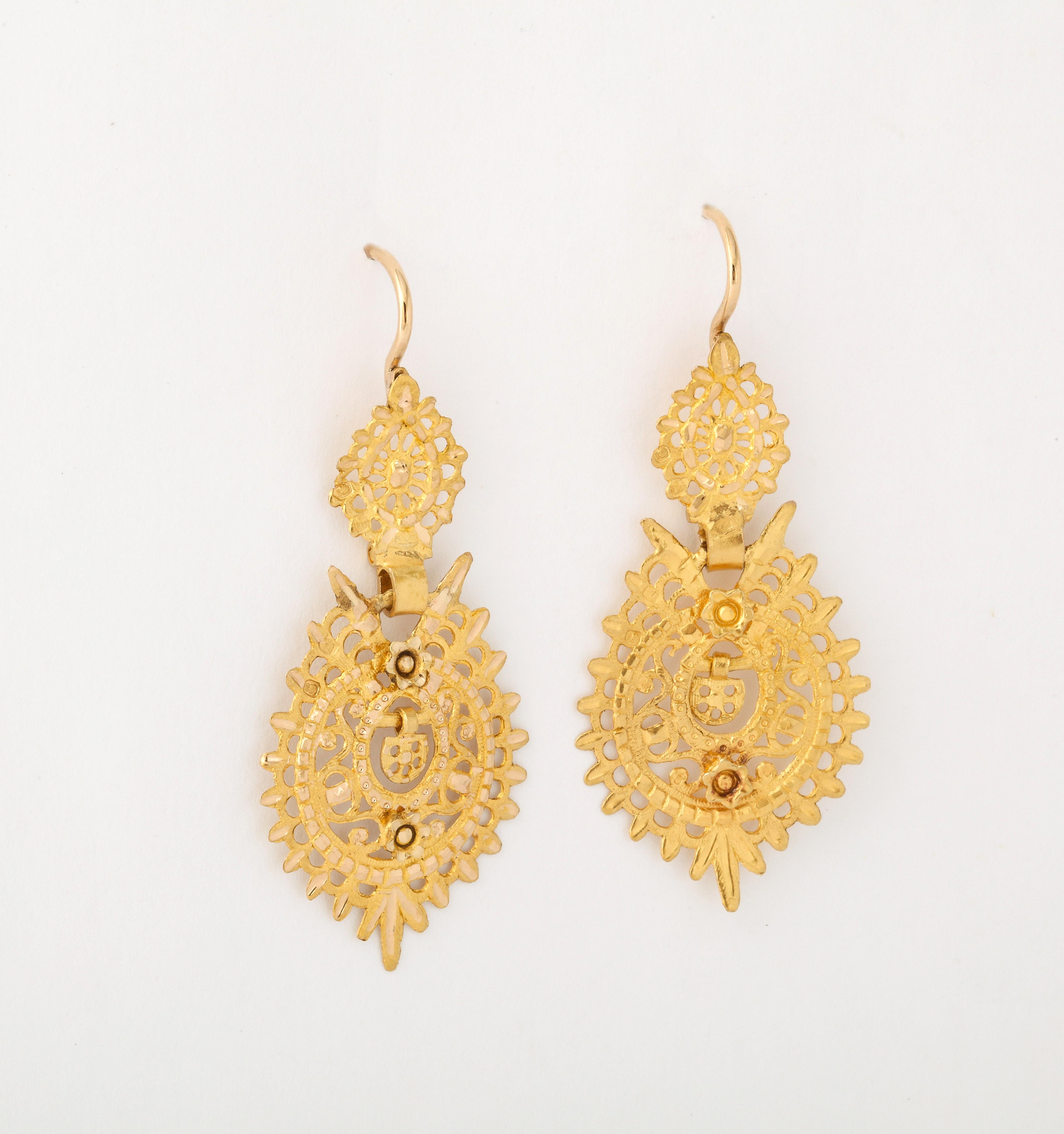 Portuguese Sequile Earrings such as these 19Kt gold lacy dangles have been made since the late 1700's in Portugal. They are classic. Most pair are much larger. This is a medium sized pair made in 1938 in the same design as the 18th century Sequels.