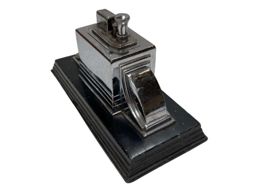 First manufactured in 1939, this black and chrome dispenser with a beautiful Machine Age look. The design is exceptional and perfectly accents any deco room where it is displayed.

The cigarette delivery mechanism works as it should. The Touch Tip