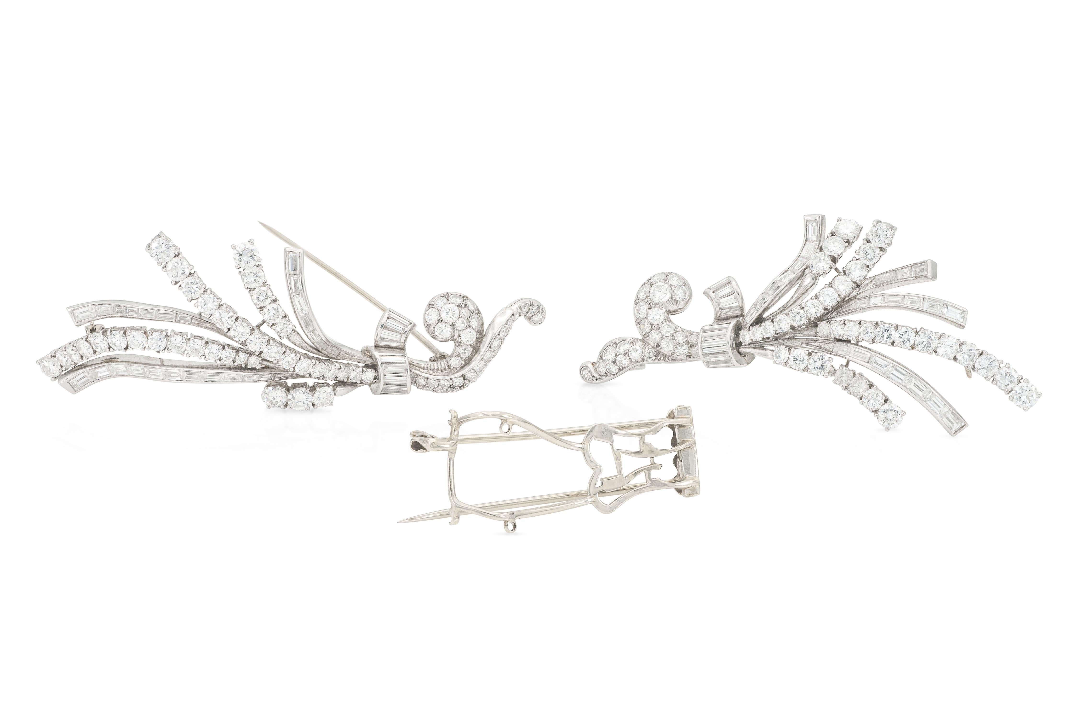 Finely crafted in platinum with Round Brilliant and Baguette cut Diamonds weighing a total of approximately 14.00 carats.
The brooch separates into two small lapel clips.
Circa 1940s
Brooch 3 x 2 1/8 inches
Individual clip 2 3/4 x 1 1/4 inches
