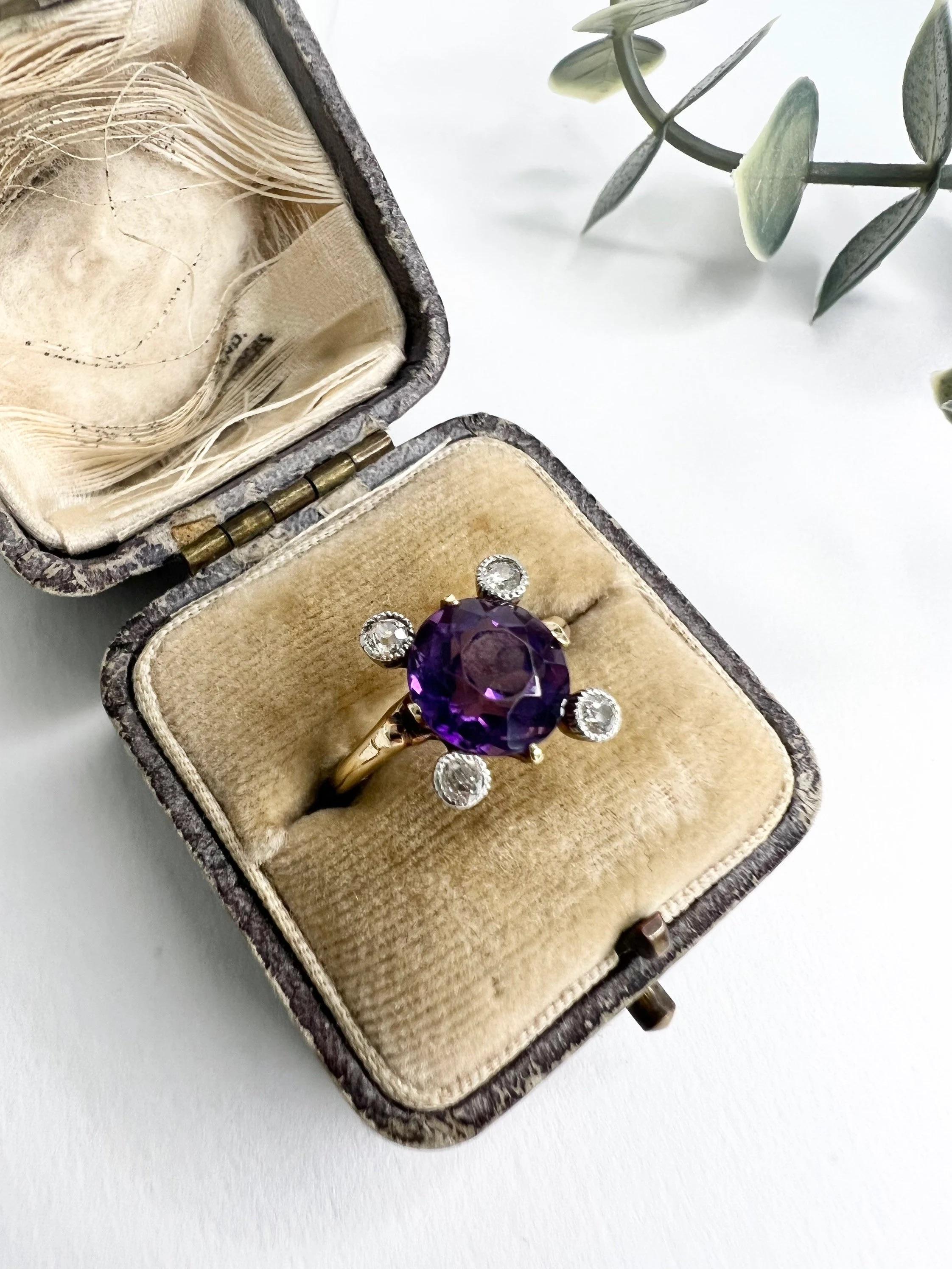 Vintage Amethyst & Diamond Ring 

14ct Gold

Circa 1940’s 

Beautiful Round, Faceted Amethyst Ring with Milgraine Set Diamond Corners. 

Ring Measures Approx: Height 11.5mm & Width 10.5mm

UK Size L

US Size 6 

Can be resized using our resizing