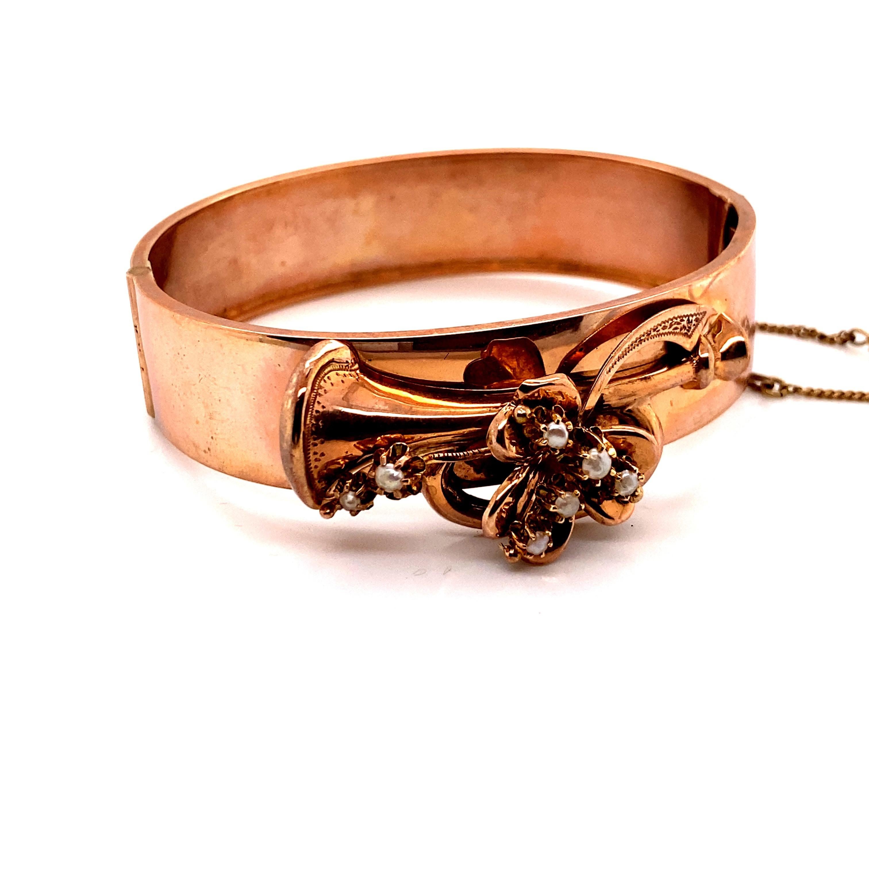 Vintage 1940's 14K Rose Gold Retro Bangle Bracelet with Trumpet Design - The trumpet is accented with 7 seed pearls. The width of the bangle is 15mm. The inside diameter is 2 inches high and 2.25 inches wide. The bracelet weighs 13 grams. 