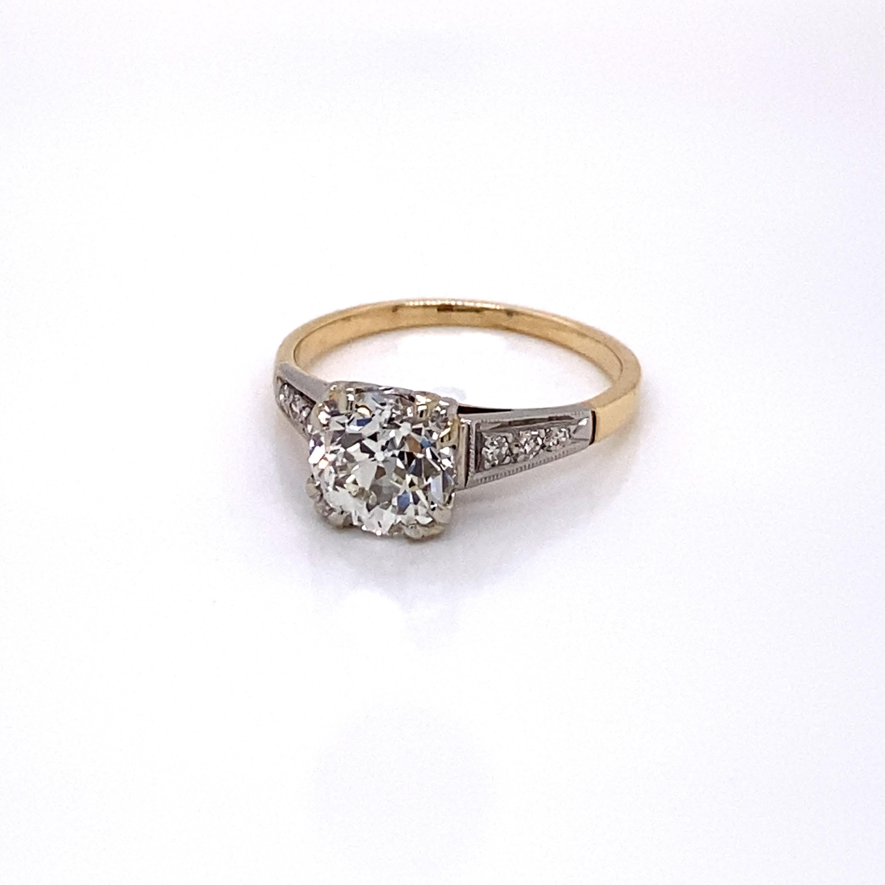 Vintage 1940s 14KY Gold and Platinum 1.56ct European Cut Diamond Engagement Ring - The center European Cut diamond weighs 1.56ct with J color and VS1 clarity. The diamond sits proudly in a platinum fishtail head. The setting has 3 single cut