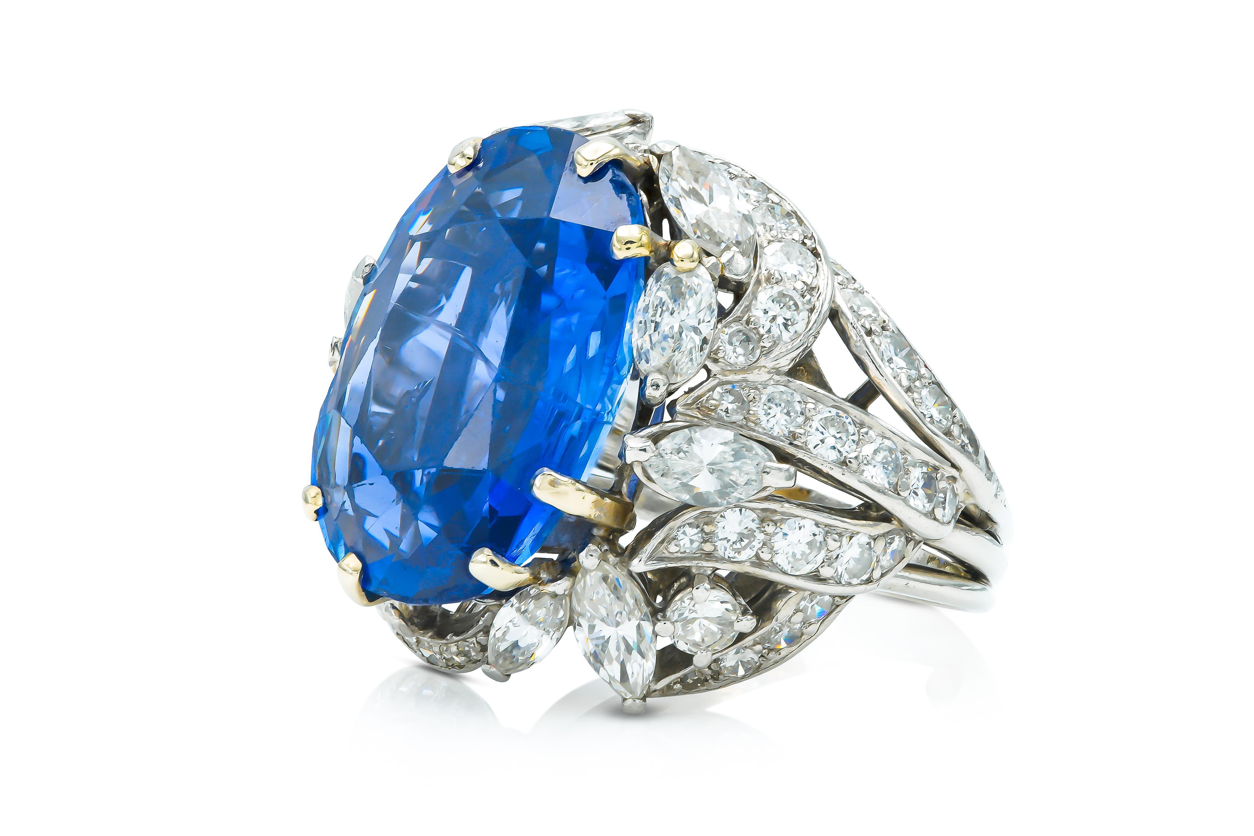 Finely crafted in platinum with an AGL certified, non-heat treated, Oval cut Sapphire weighing 15.13 carats.
The ring features Marquise and Round Brilliant cut Diamonds weighing a total of approximately 5.45 carats.
Circa 1940s
Size 5, resizable