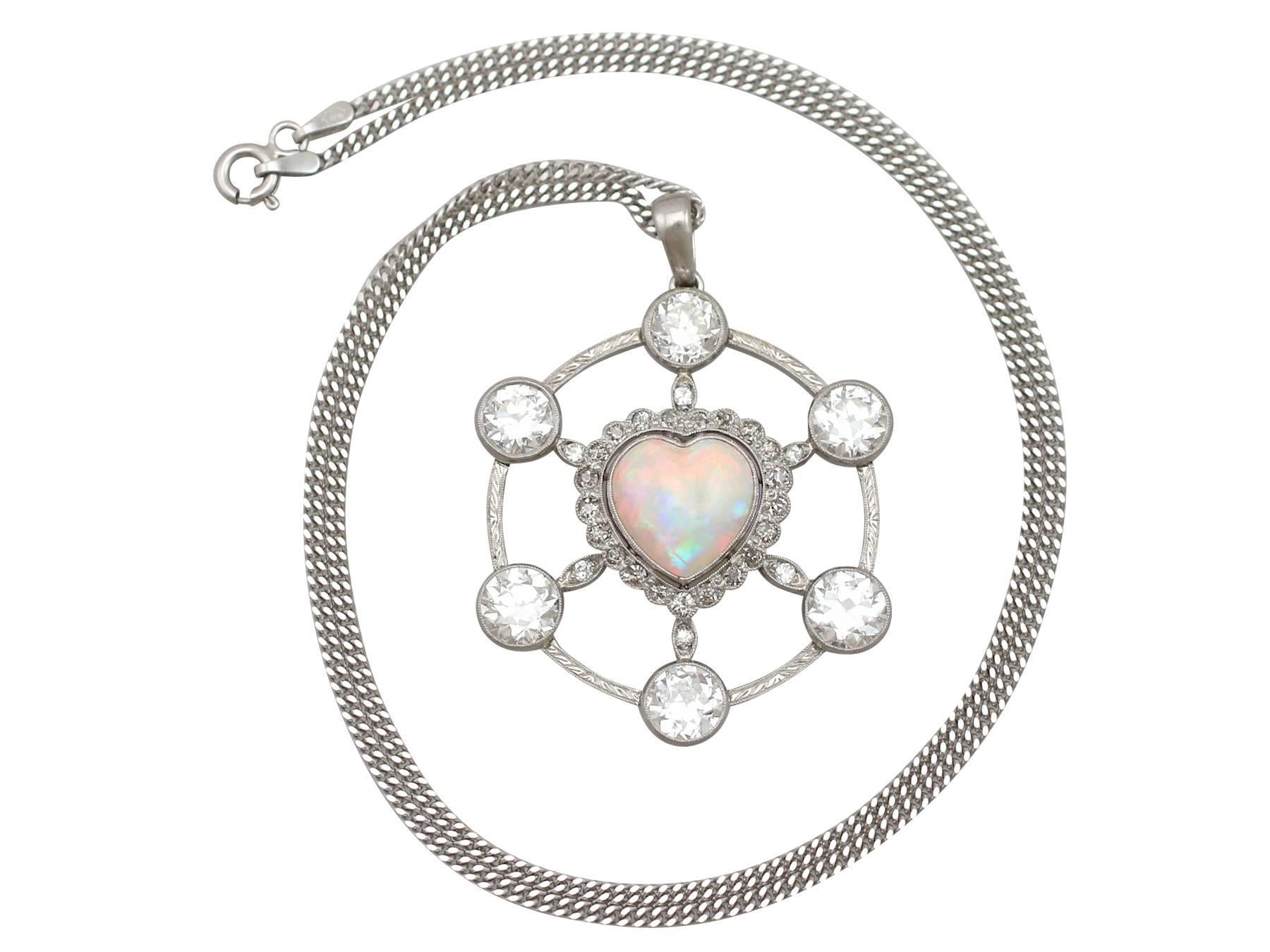 A stunning vintage 2.47 carat opal, 5.34 carat diamond and platinum pendant with 18 karat white gold chain; part of our diverse gemstone jewelry collections.

This stunning, fine and impressive heart opal pendant has been crafted in platinum.

The