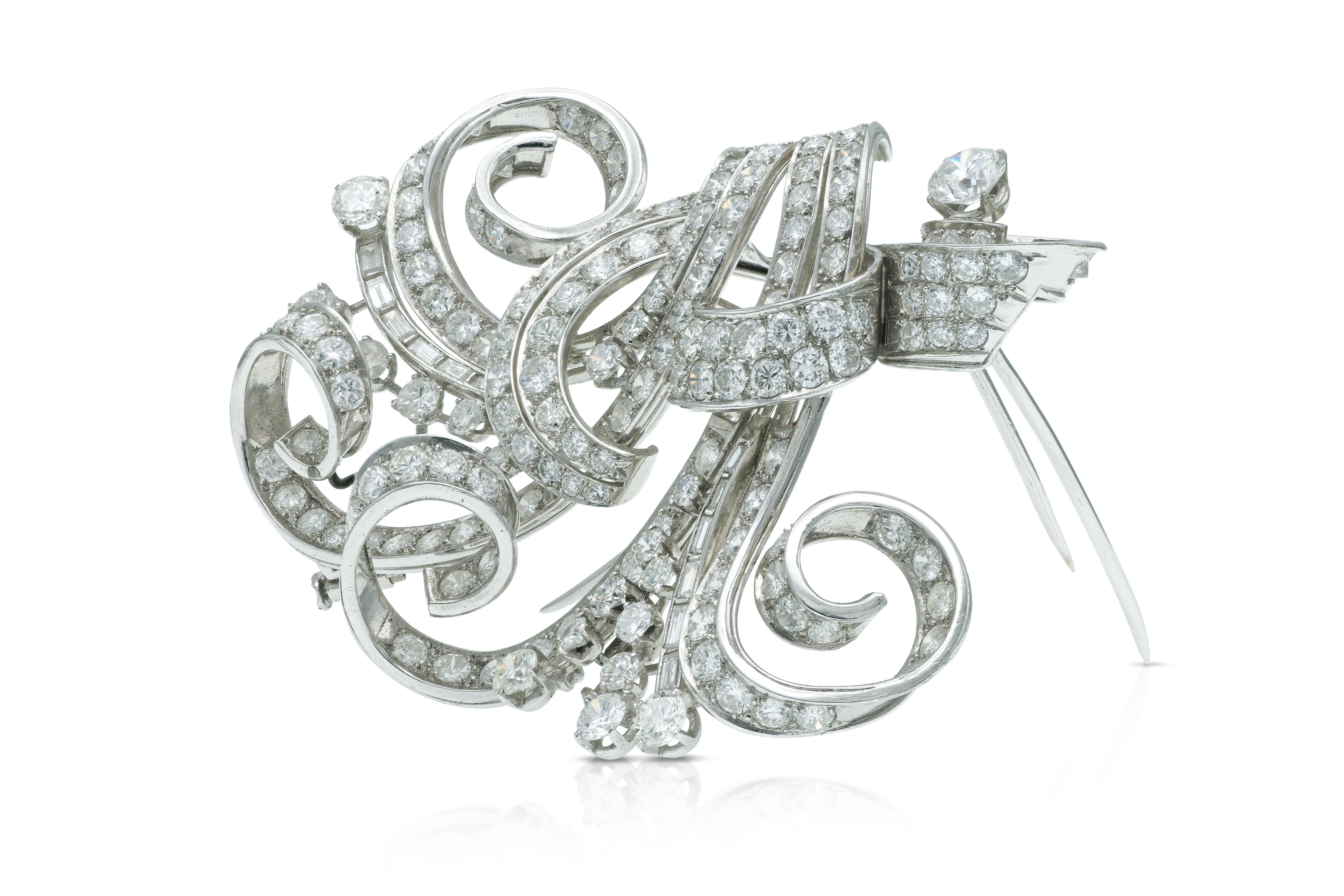 Finely crafted in platinum with Round Brilliant and Baguette cut Diamonds weighing a total of approximately 25.00 carats.
The brooch separates into two small clips.
Circa 1940s
Brooch 2 1/8 x 2 7/8 inches
Individual clip 2 1/8 x 1 5/8 inches