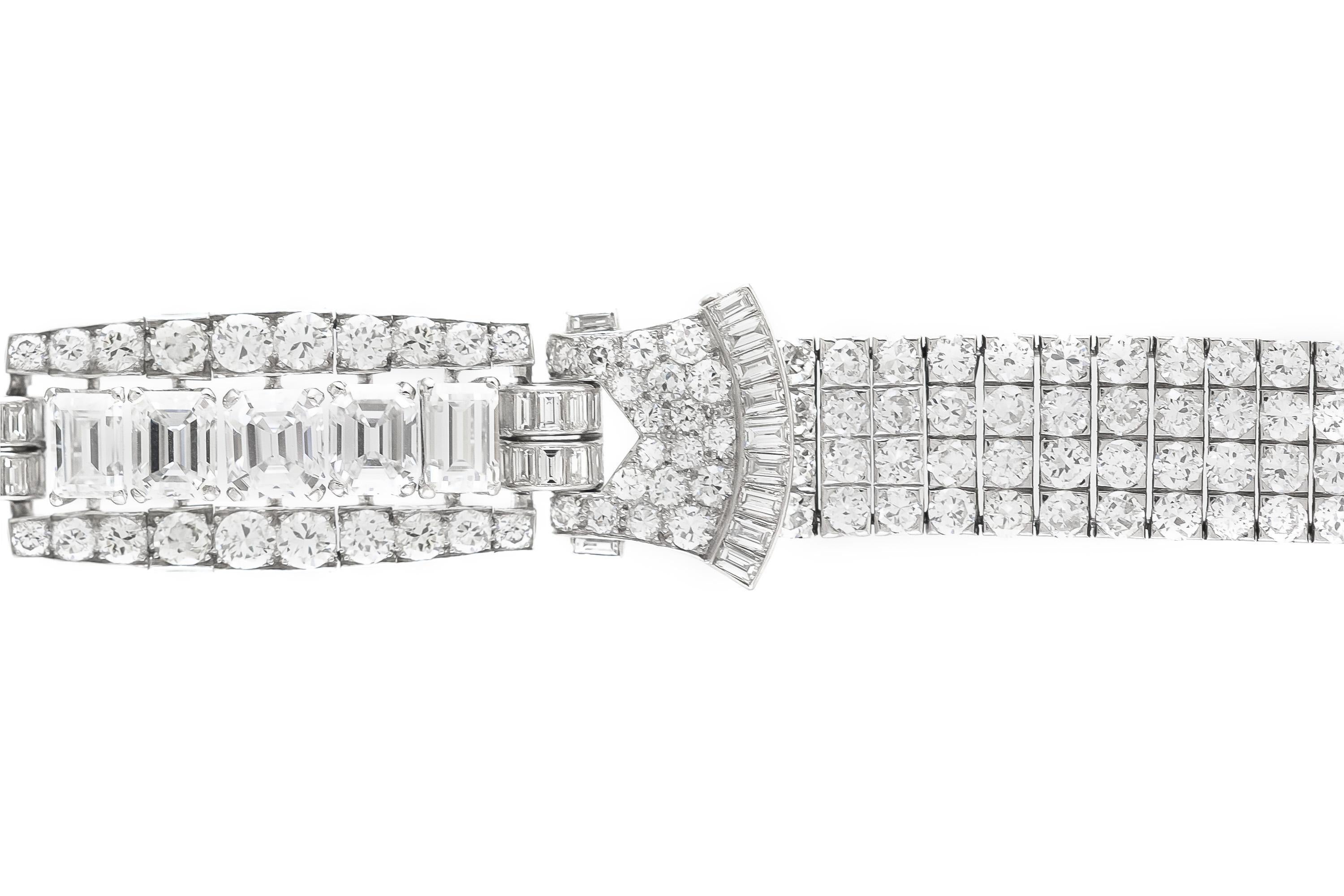 Finely crafted in platinum with 5 GIA certified Emerald cut Diamonds at the center weighing a total of 7.73 carats, and Old European and Baguette cut Diamonds weighing approximately a total of 23.00 carats.
The 5 GIA certified Emerald cut Diamond